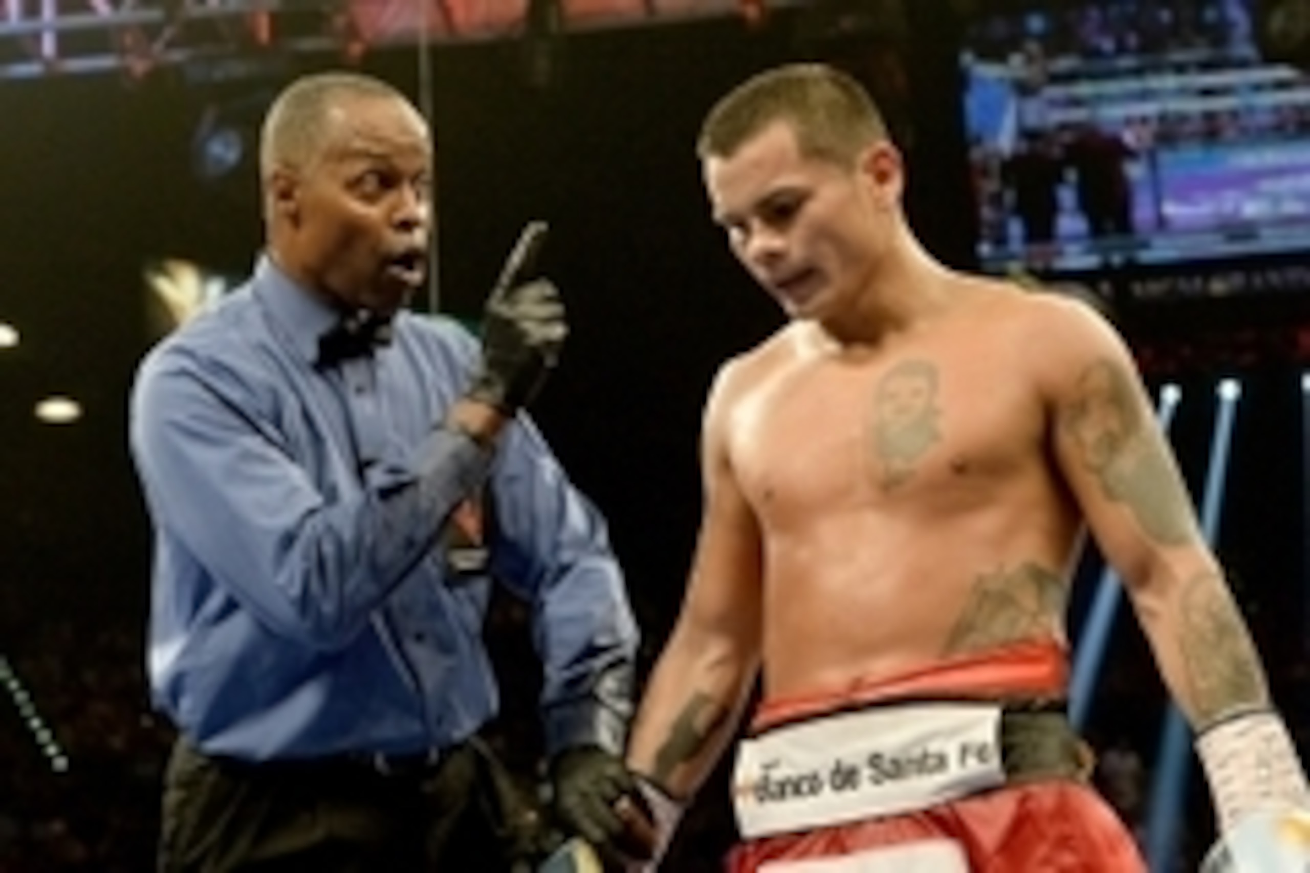Sep 13, 2014; Las Vegas, NV, USA; Boxing referee Kenny Bayless takes a point from Marcos Maidana for pushing down Floyd Mayweather (not pictured) during their WBC & WBA Welterweight and WBC Superwelter Weight title fight at the MGM Grand Garden Arena. Man Sep 13, 2014; Las Vegas, NV, USA; Boxing referee Kenny Bayless takes a point from Marcos Maidana for pushing down Floyd Mayweather (not pictured) during their WBC & WBA Welterweight and WBC Superwelter Weight title fight at the MGM Grand Garden Arena. Man