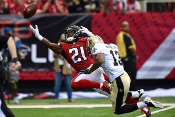 Sep 7, 2014; Atlanta, GA, USA; Atlanta Falcons cornerback Desmond Trufant (21) defends on a pass intended for New Orleans Saints wide receiver Joe Morgan (13) during the first quarter at the Georgia Dome. Mandatory Credit: Dale Zanine-USA TODAY Sports