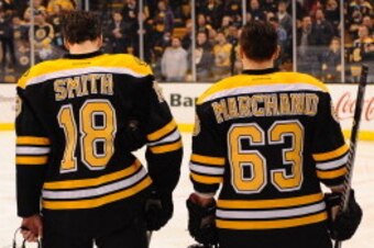 BOSTON, MA - JANUARY 30: Matt Bartkowski #43, Reilly Smith #18 and Brad Marchand #63 of the Boston Bruins stand on the ice as the starting line up against the Montreal Canadiens at the TD Garden on January 30, 2014 in Boston, Massachusetts.  (Photo by Ste