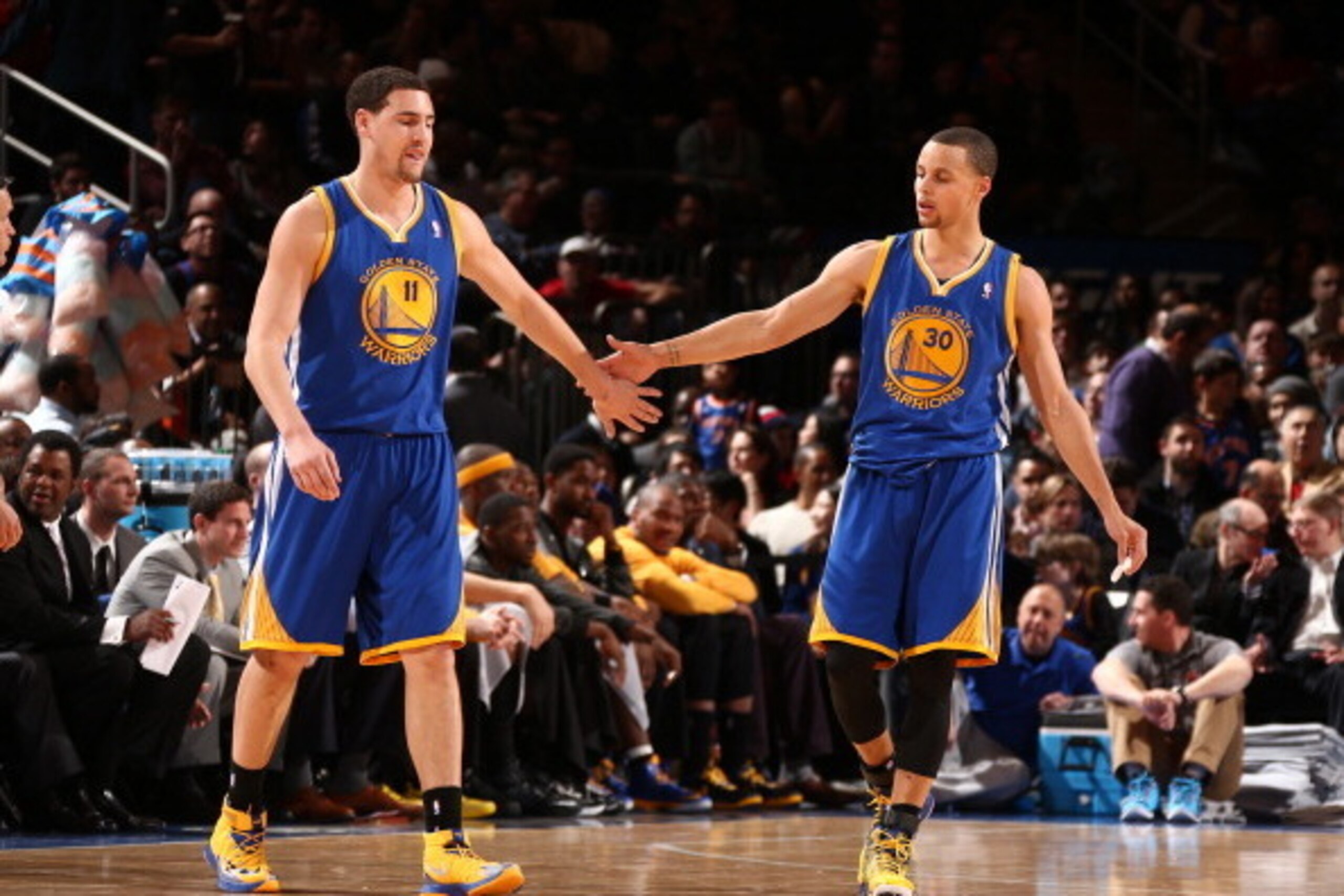 NEW YORK, NY - FEBRUARY 28: Klay Thompson #11 of the Golden State Warriors high-fives teammate Stephen Curry #30 during a game against the New York Knicks at Madison Square Garden in New York City on February 28, 2014. NOTE TO USER: User expressly acknow NEW YORK, NY - FEBRUARY 28: Klay Thompson #11 of the Golden State Warriors high-fives teammate Stephen Curry #30 during a game against the New York Knicks at Madison Square Garden in New York City on February 28, 2014. NOTE TO USER: User expressly acknow