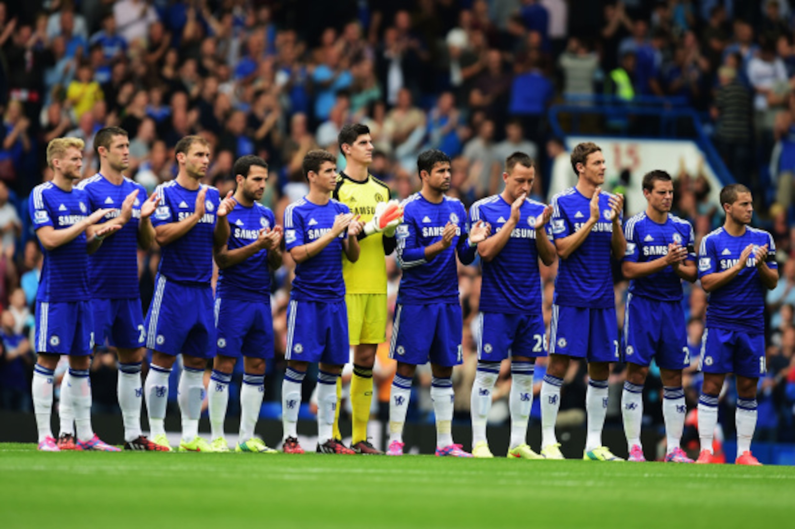 LONDON, ENGLAND - SEPTEMBER 13:  Chelsea players remember Lord Attenborough prior to the Barclays Premier League match between Chelsea and Swansea City at Stamford Bridge on September 13, 2014 in London, England.  (Photo by Jamie McDonald/Getty Images)