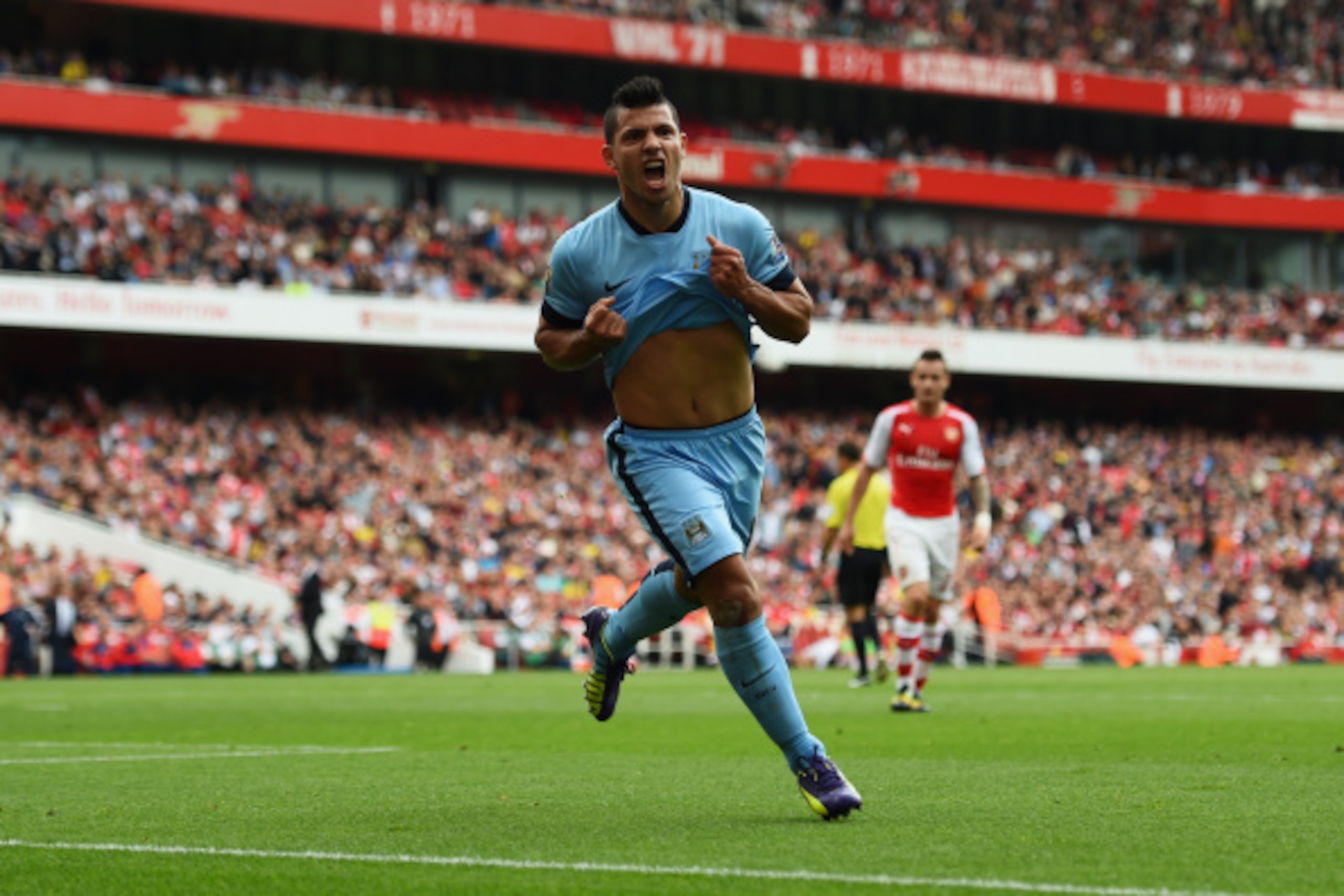 LONDON, ENGLAND - SEPTEMBER 13:  Sergio Aguero of Manchester City celebrates scoring the opening goal during the Barclays Premier League match between Arsenal and Manchester City at Emirates Stadium on September 13, 2014 in London, England.  (Photo by Sha