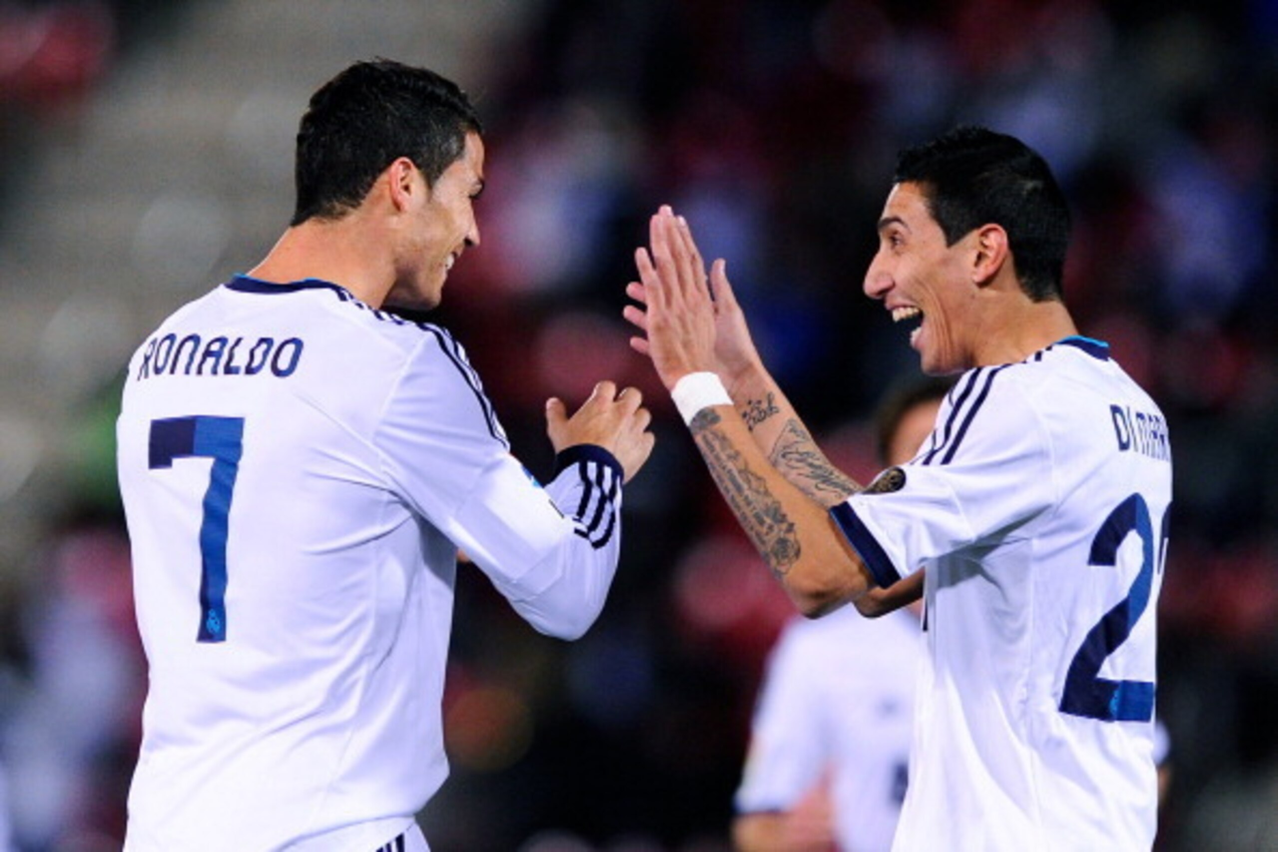 MALLORCA, SPAIN - OCTOBER 28:  Cristiano Ronaldo of Real Madrid CF (L) celebrates with his teammate Angel Di Maria of Real Madrid CF after scoring his team's second goal during the La Liga match between RCD Mallorca and Real Madrid CF at Iberostar Stadium