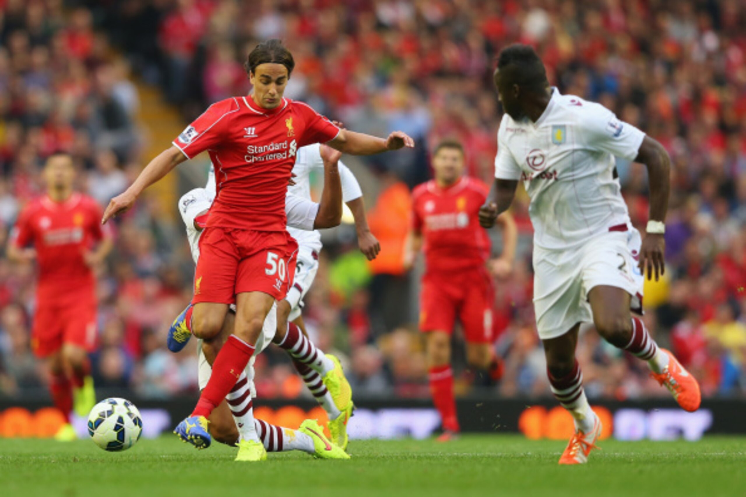 LIVERPOOL, ENGLAND - SEPTEMBER 13: Lazar Markovic of Liverpool makes a break during the Barclays Premier League match between Liverpool and Aston Villa at Anfield on September 13, 2014 in Liverpool, England.  (Photo by Alex Livesey/Getty Images)