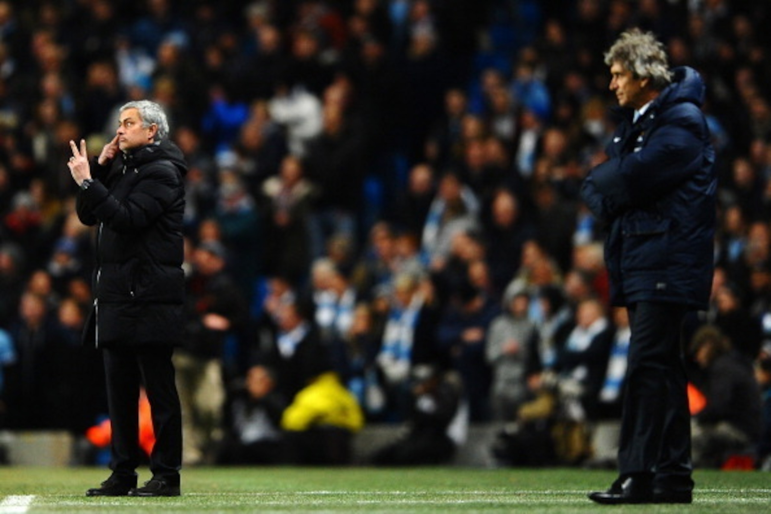 MANCHESTER, ENGLAND - FEBRUARY 03: Manuel Pellegrini manager of Manchester City looks on as Jose Mourinho manager of Chelsea give instructions during the Barclays Premier League match between Manchester City and Chelsea at Etihad Stadium on February 3, MANCHESTER, ENGLAND - FEBRUARY 03: Manuel Pellegrini manager of Manchester City looks on as Jose Mourinho manager of Chelsea give instructions during the Barclays Premier League match between Manchester City and Chelsea at Etihad Stadium on February 3,