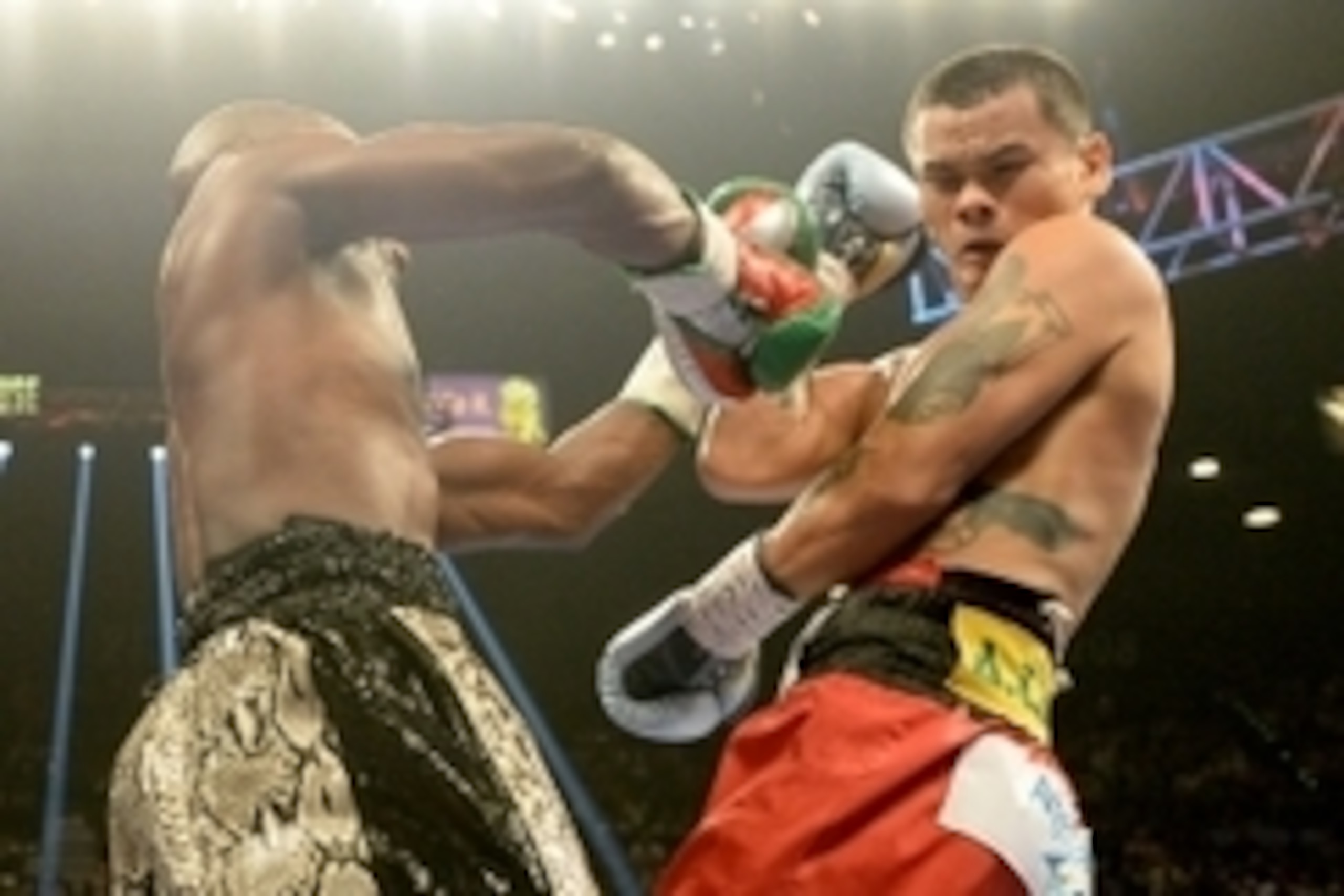 Sep 13, 2014; Las Vegas, NV, USA; Floyd Mayweather (green gloves) and Marcos Maidana (blue gloves) during their WBC & WBA Welterweight and WBC Superwelter Weight title fight at the MGM Grand Garden Arena. Mandatory Credit: Jayne Kamin-Oncea-USA TODAY Spor
