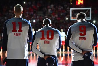 MADRID, SPAIN - SEPTEMBER 14: Mason Plumlee #11, Kyrie Irving #10, and DeMar DeRozan #9 of the USA Men's National Team stands for the National Anthem against the Serbia National Team during the 2014 FIBA World Cup Finals at Palacio de Deportes on Septembe