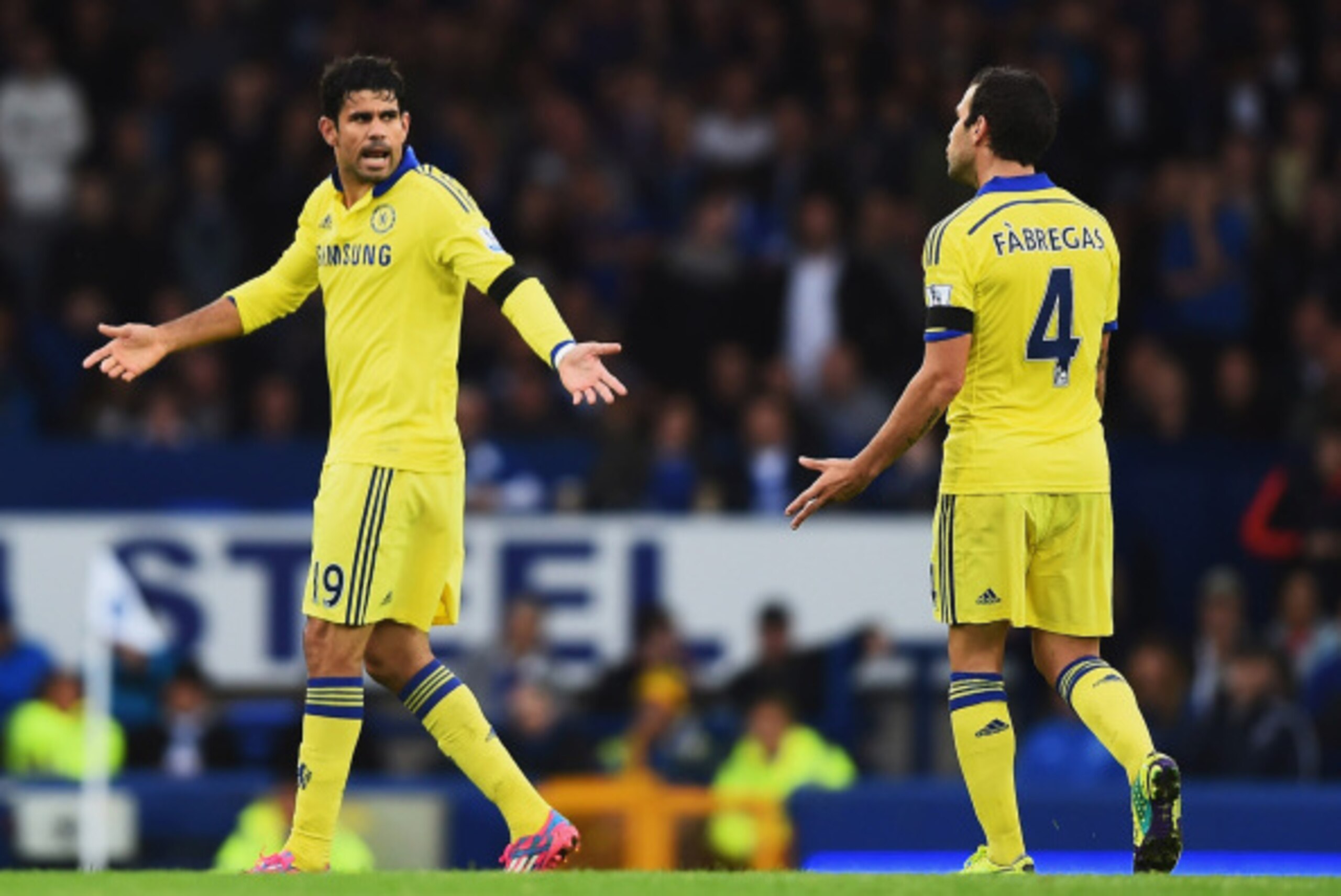 LIVERPOOL, ENGLAND - AUGUST 30: Diego Costa of Chelsea exchanges words with Cesc Fabregas of Chelsea during the Barclays Premier League match between Everton and Chelsea at Goodison Park on August 30, 2014 in Liverpool, England.  (Photo by Laurence Griffi