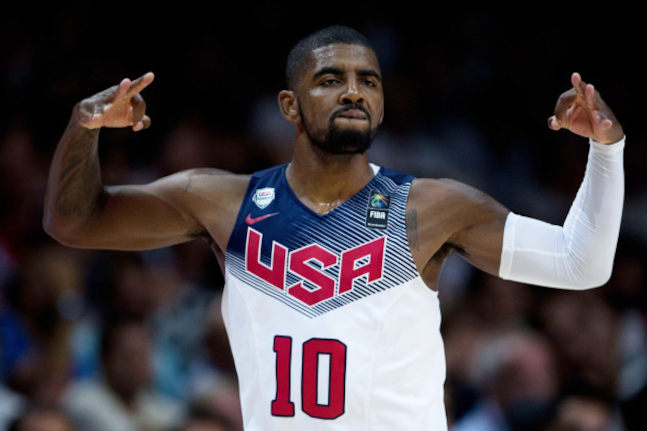 MADRID, SPAIN - SEPTEMBER 14:  Kyrie Irving of the USA celebrates scoring during the 2014 FIBA World Basketball Championship final match between USA and Serbia at Palacio de los Deportes on September 14, 2014 in Madrid, Spain.  (Photo by Gonzalo Arroyo Mo