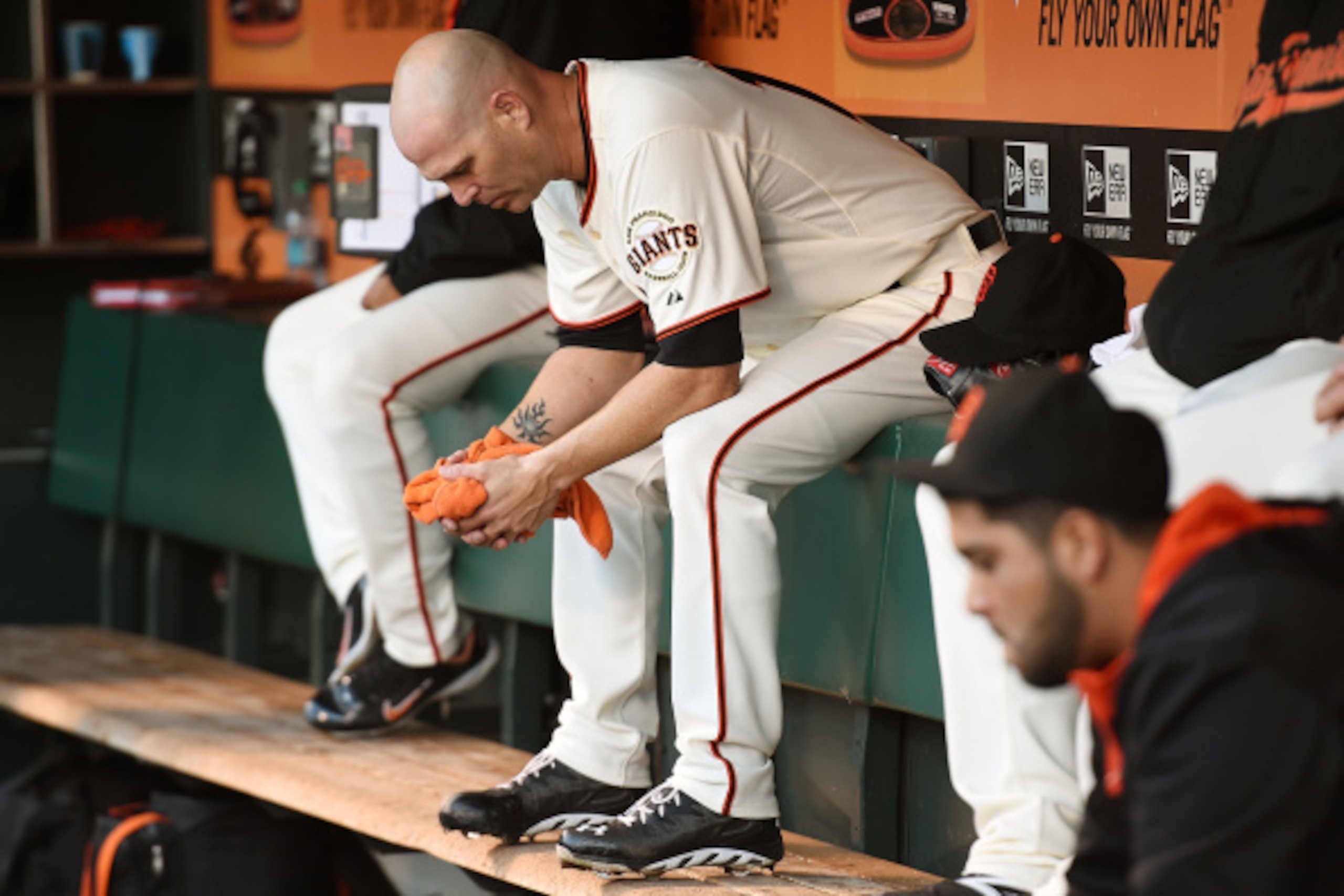 SAN FRANCISCO, CA - SEPTEMBER 13:  Tim Hudson #17 of the San Francisco Giants sits in the dugout gripping a towl after he was taken out of the game against the Los Angeles Dodgers in the top of the second inning at AT&T Park on September 13, 2014 in San F