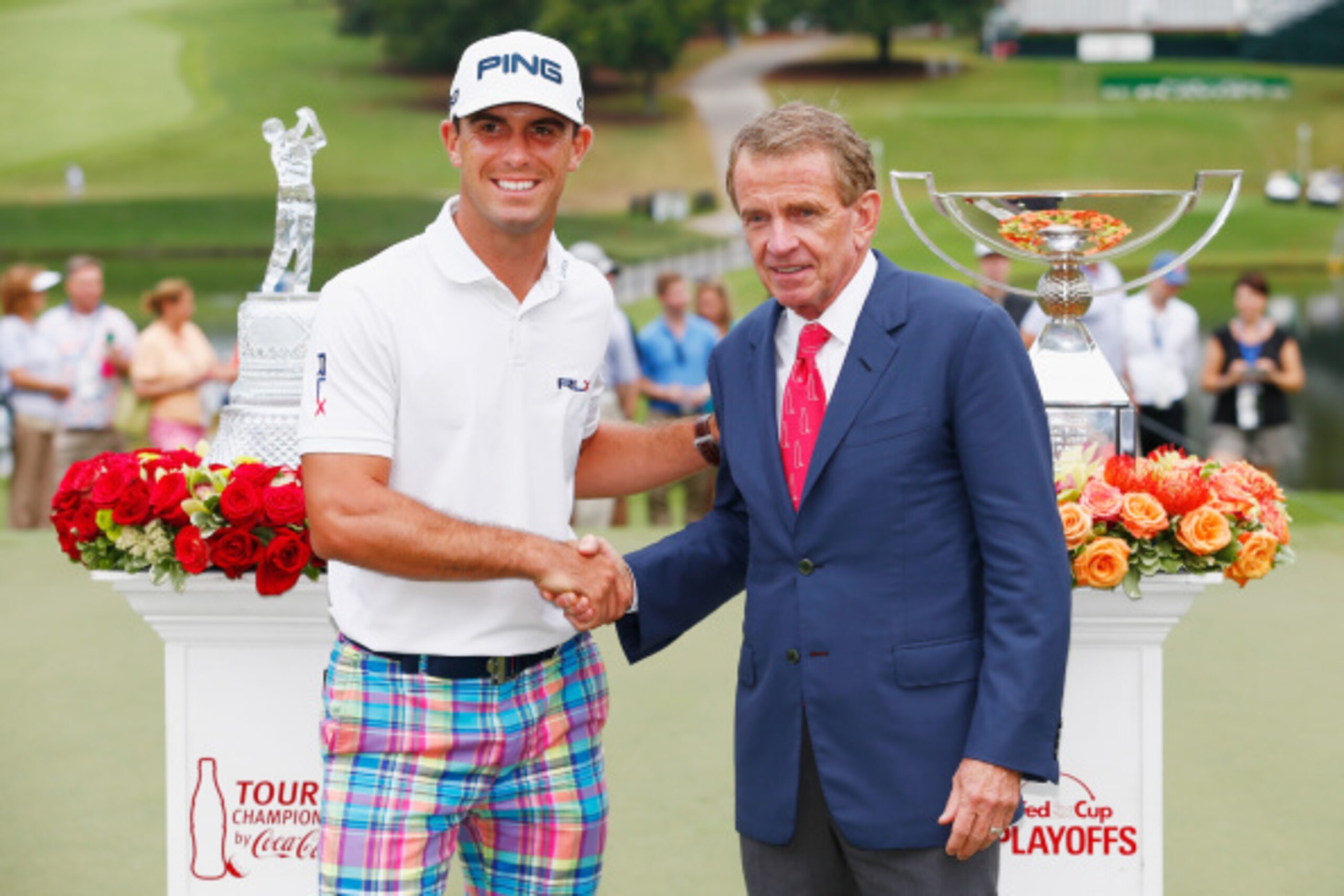 ATLANTA, GA - SEPTEMBER 14:  Billy Horschel of the United States poses on the 18th green with PGA Tour Commissioner Tim Finchem after winning both the TOUR Championship by Coca-Cola and the FedExCup Playoffs at the East Lake Golf Club on September 14, 201