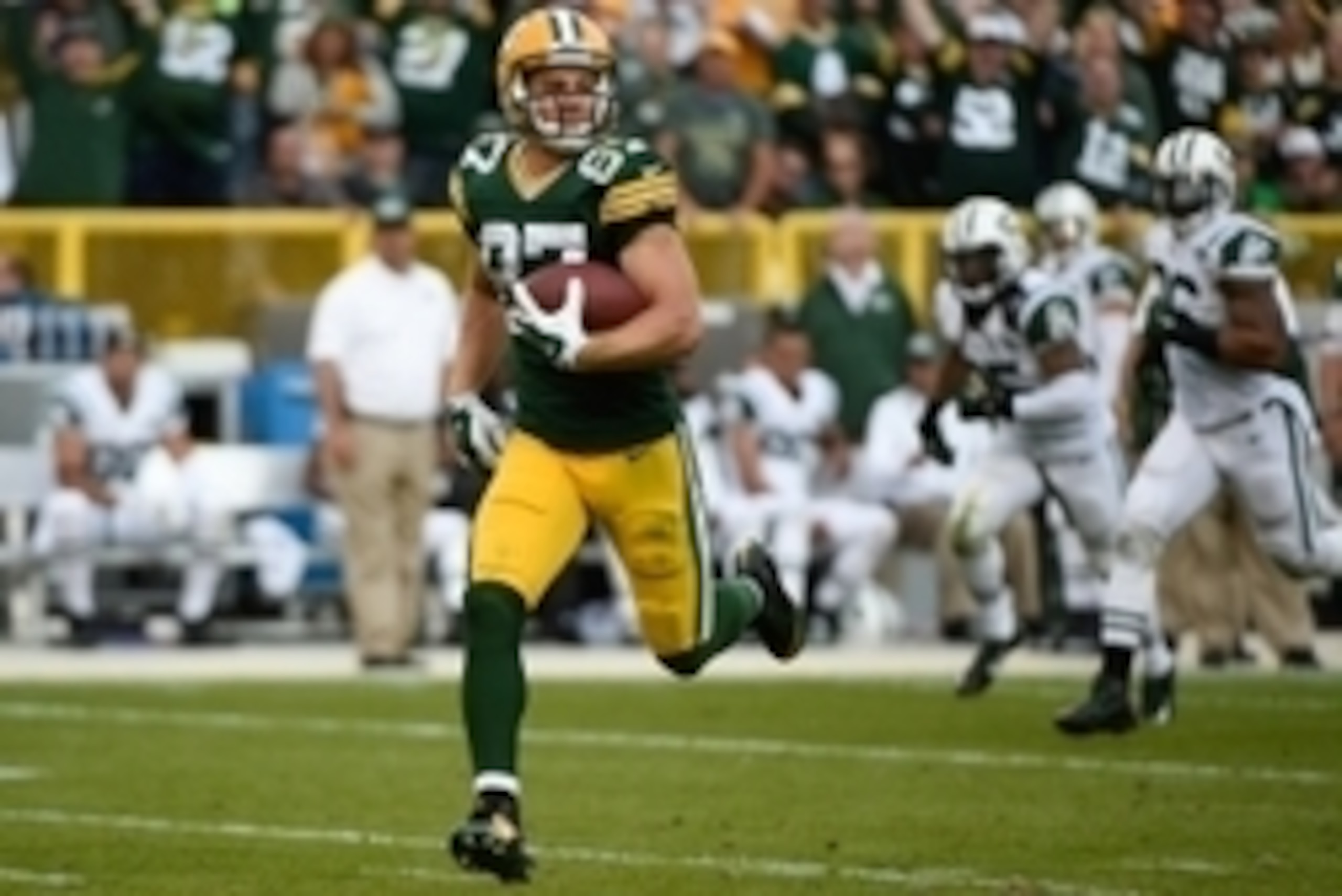 Sep 14, 2014; Green Bay, WI, USA; Green Bay Packers wide receiver Jordy Nelson (87) runs after catching a pass for an 80-yard touchdown score in the third quarter against the New York Jets at Lambeau Field. Mandatory Credit: Benny Sieu-USA TODAY Sports