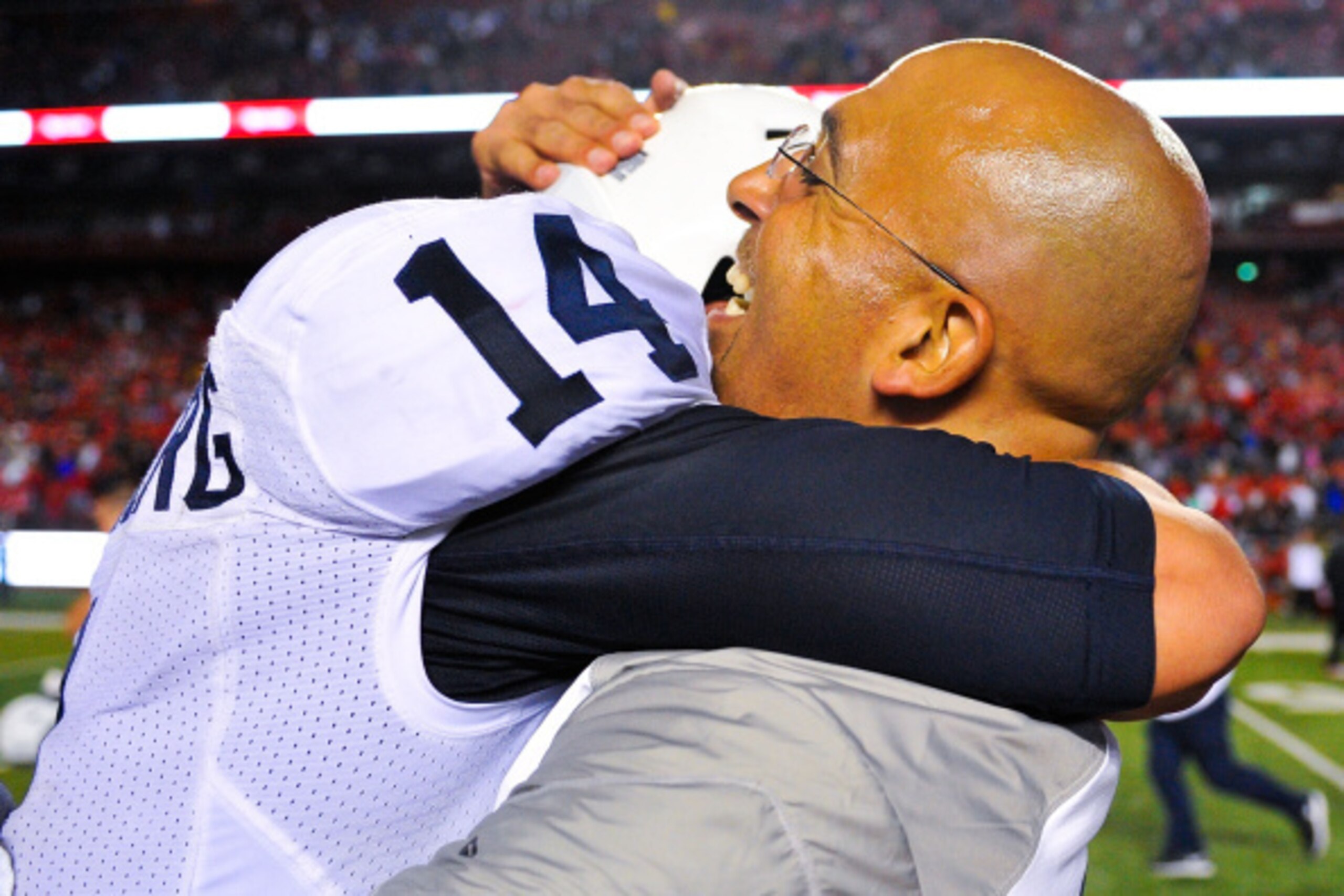 PISCATAWAY, NJ - SEPTEMBER 13: Head coach James Franklin of the Penn State Nittany Lions hugs quarterback Christian Hackenberg #14 after a game against the Rutgers Scarlet Knights at High Point Solutions Stadium on September 13, 2014 in Piscataway, New Je