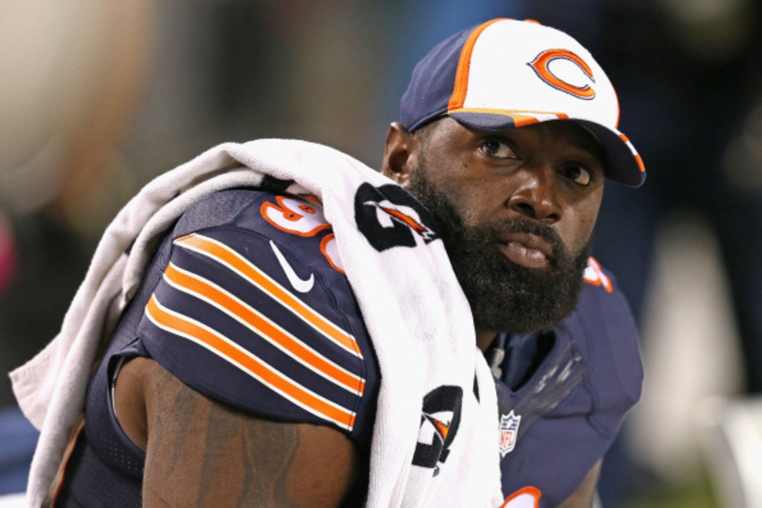 CHICAGO, IL - AUGUST 14:  Jeremiah Ratliff #90 of the Chicago Bears sits on the bench during a preseason game against the Jacksonville Jaguars at Soldier Field on August 14, 2014 in Chicago, Illinois.  The Bears defeated the Jaguars 20-19.  (Photo by Jona