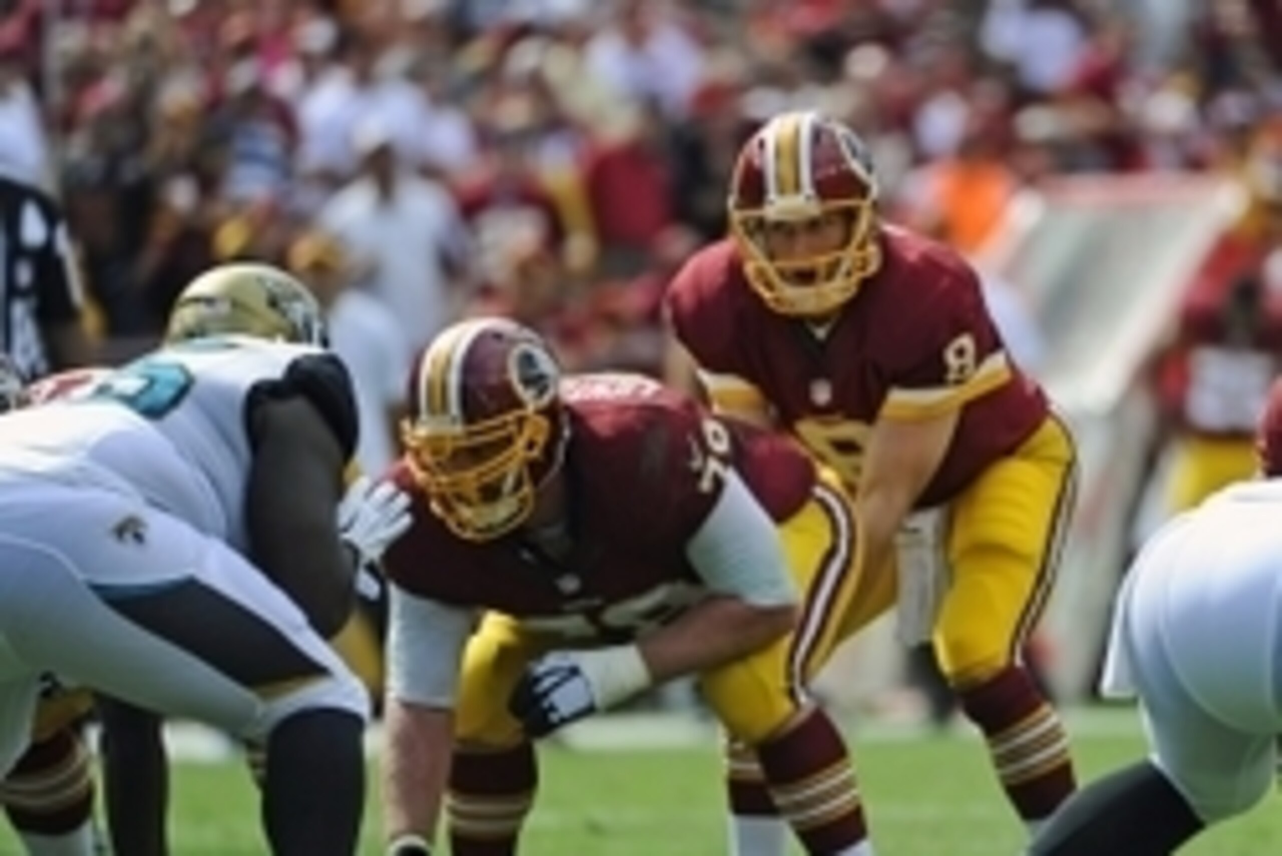Sep 14, 2014; Landover, MD, USA; Washington Redskins quarterback Kirk Cousins (8) prepares for the snap from Washington Redskins center Kory Lichtensteiger (78) against the Jacksonville Jaguarse during the second half at FedEx Field. Mandatory Credit: Bra