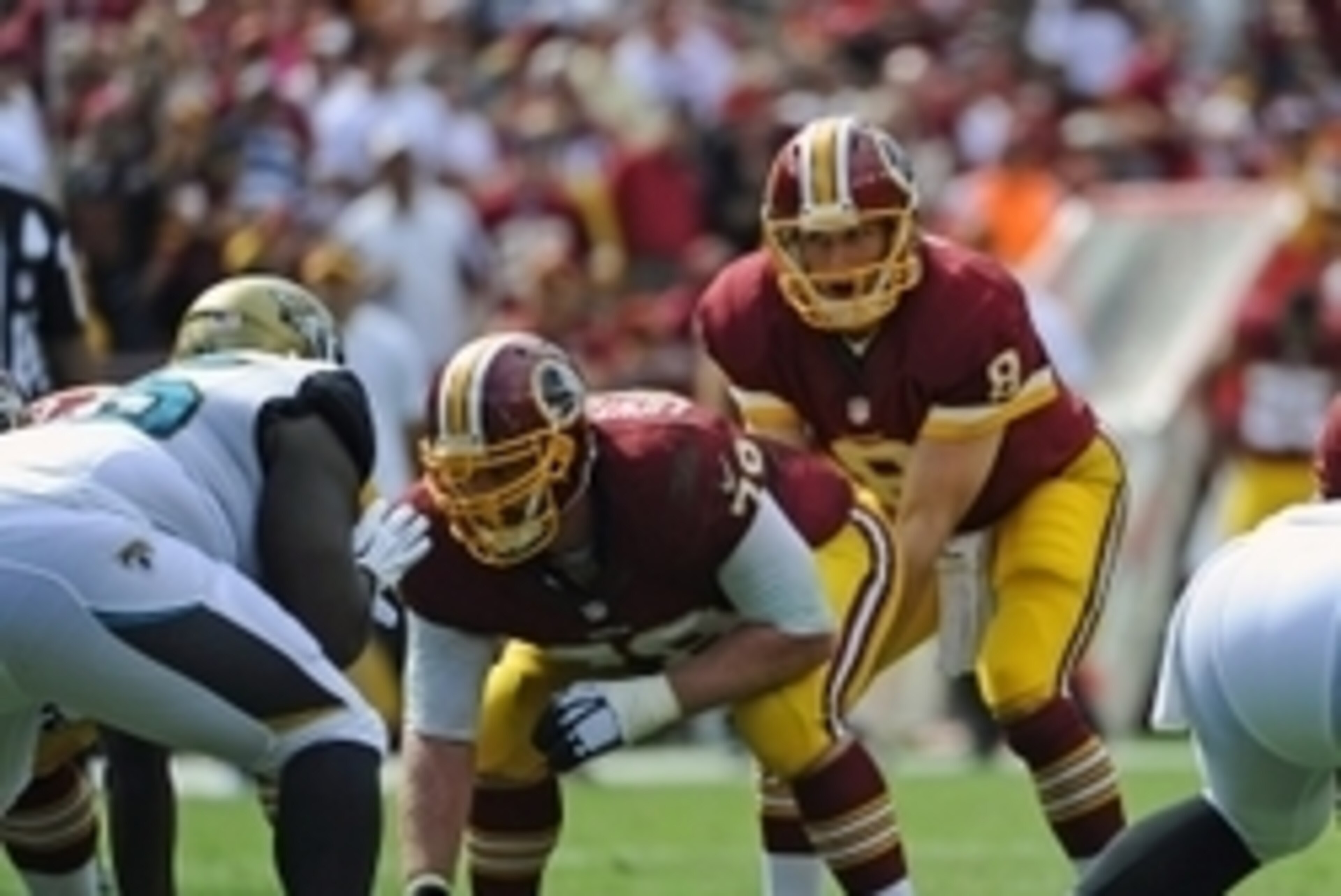 Sep 14, 2014; Landover, MD, USA; Washington Redskins quarterback Kirk Cousins (8) prepares for the snap from Washington Redskins center Kory Lichtensteiger (78) against the Jacksonville Jaguarse during the second half at FedEx Field. Mandatory Credit: Bra