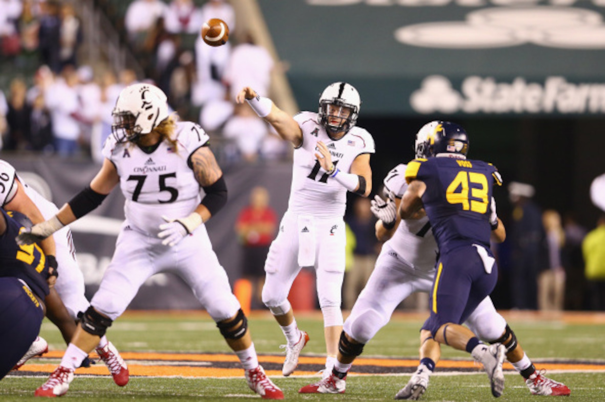 CINCINNATI, OH - SEPTEMBER 12:  Gunner Kiel #11 of the Cincinnati Bearcats throws a pass during the game against the Toledo Rockets at Paul Brown Stadium on September 12, 2014 in Cincinnati, Ohio.  (Photo by Andy Lyons/Getty Images)