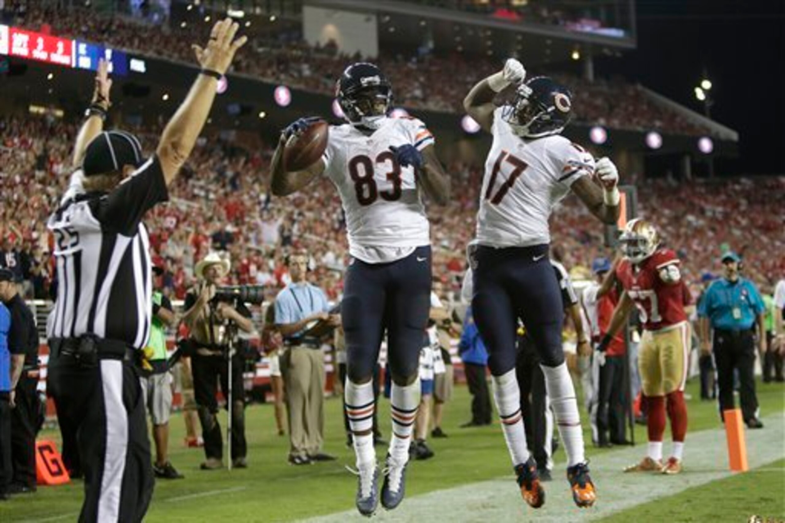 Alshon Jeffery (17) celebrates with Martellus Bennett (83) after the tight end's touchdown grab.