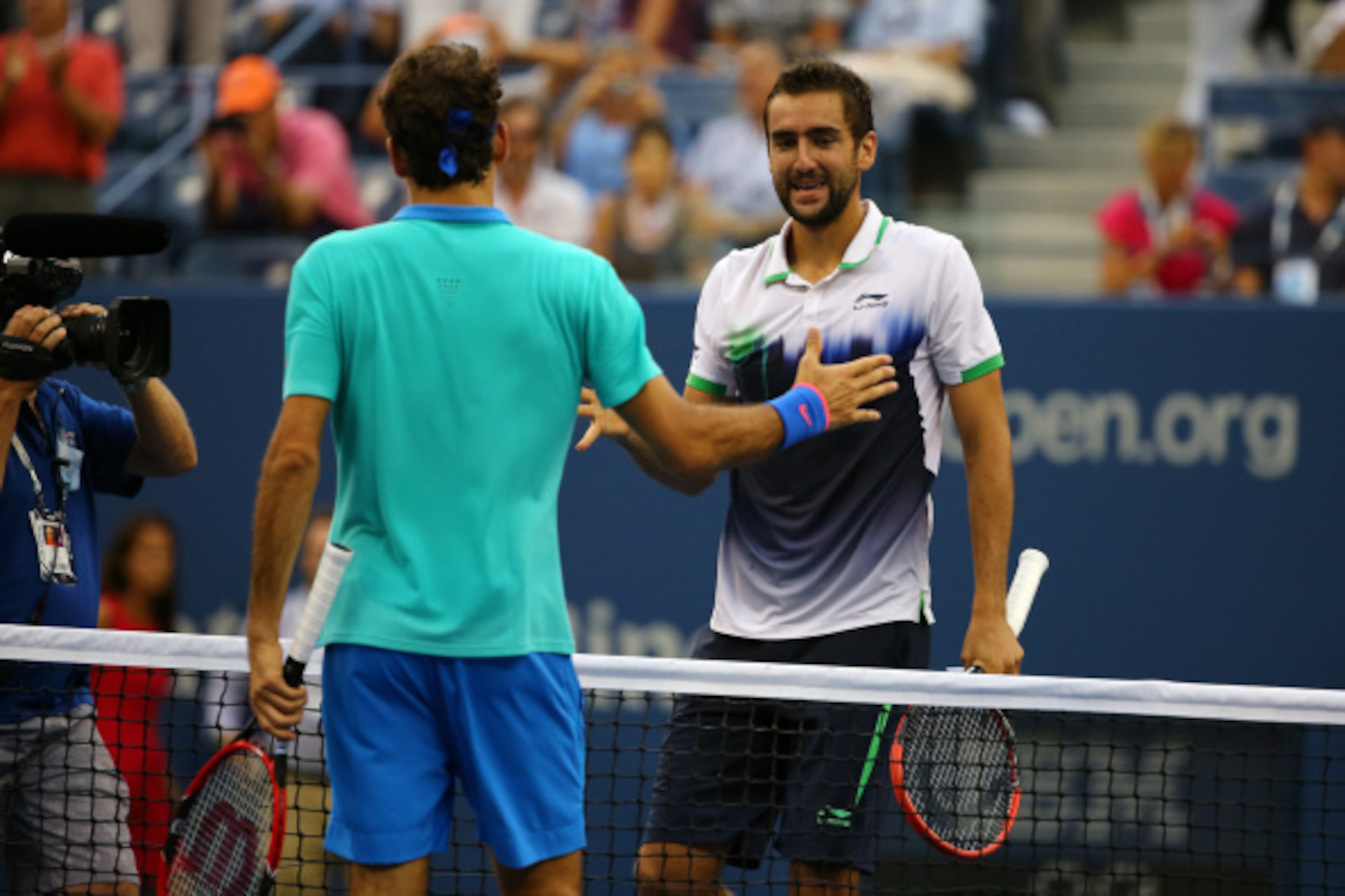 NEW YORK, NY - SEPTEMBER 06:  Roger Federer of Switzerland greets Marin Cilic (R) of Croatia after their men's singles semifinal match on Day Thirteen of the 2014 US Open at the USTA Billie Jean King National Tennis Center on September 6, 2014 in the Flus