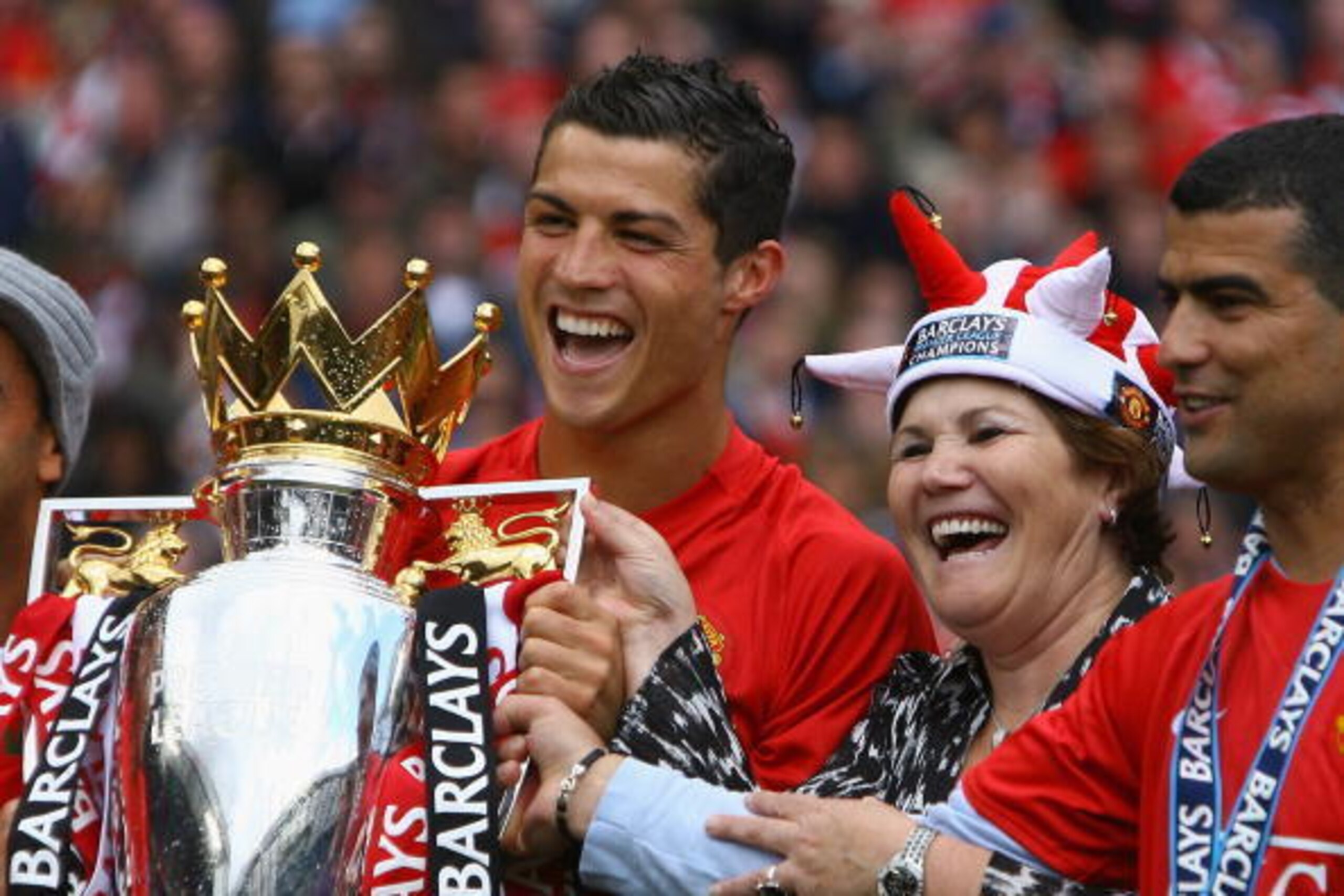 MANCHESTER, ENGLAND - MAY 16:  Cristiano Ronaldo of Manchester United celebrates winning the Barclays Premier League trophy with his mother, Dolores Aveiro after the Barclays Premier League match between Manchester United and Arsenal at Old Trafford on Ma