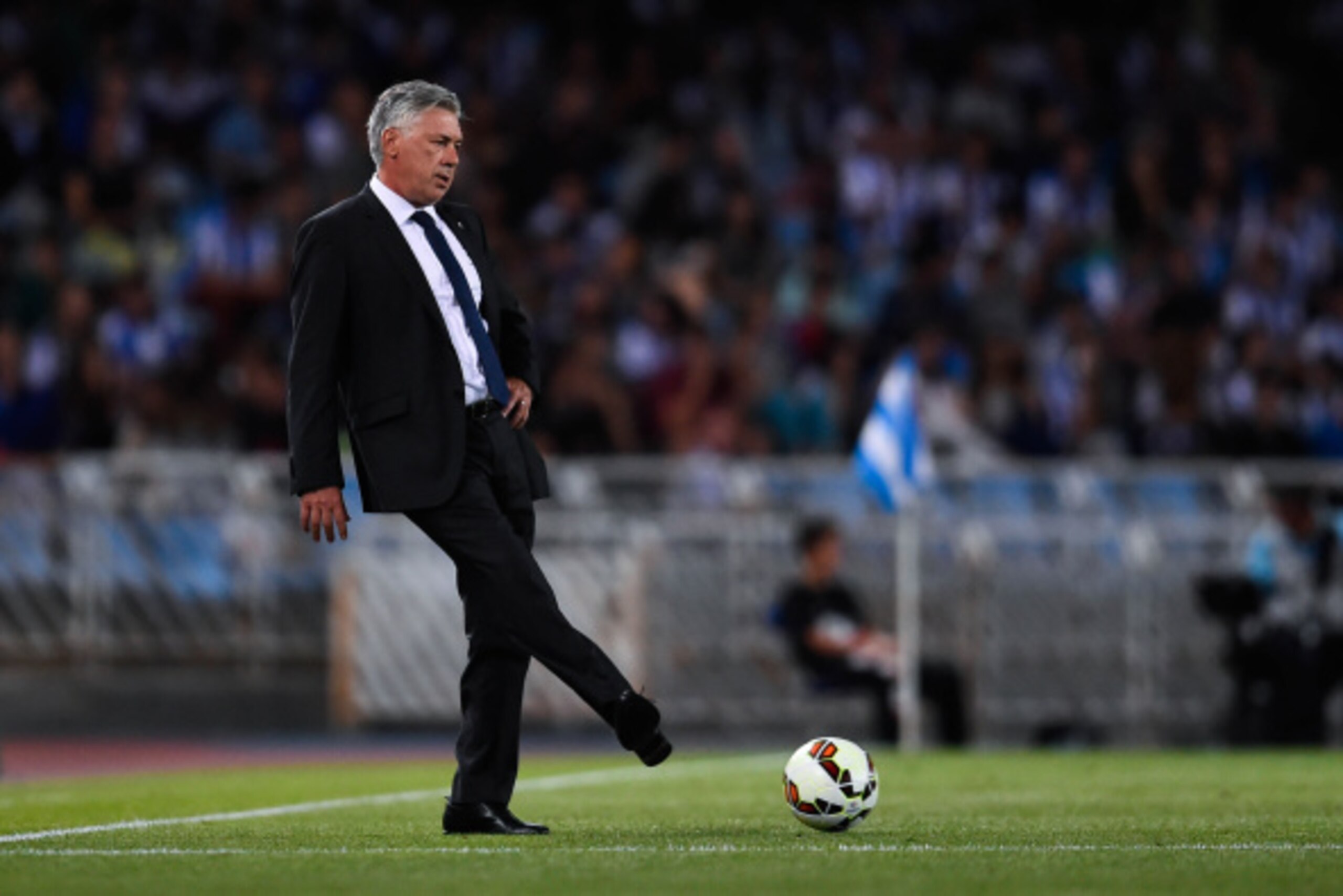 SAN SEBASTIAN, SPAIN - AUGUST 31: Head Coach Carlo Ancelotti of Real Madrid CF kicks the ball during the La Liga match between Real Sociedad de Futbol and Real Madrid CF at Estadio Anoeta on August 31, 2014 in San Sebastian, Spain. (Photo by David Ramos SAN SEBASTIAN, SPAIN - AUGUST 31: Head Coach Carlo Ancelotti of Real Madrid CF kicks the ball during the La Liga match between Real Sociedad de Futbol and Real Madrid CF at Estadio Anoeta on August 31, 2014 in San Sebastian, Spain. (Photo by David Ramos