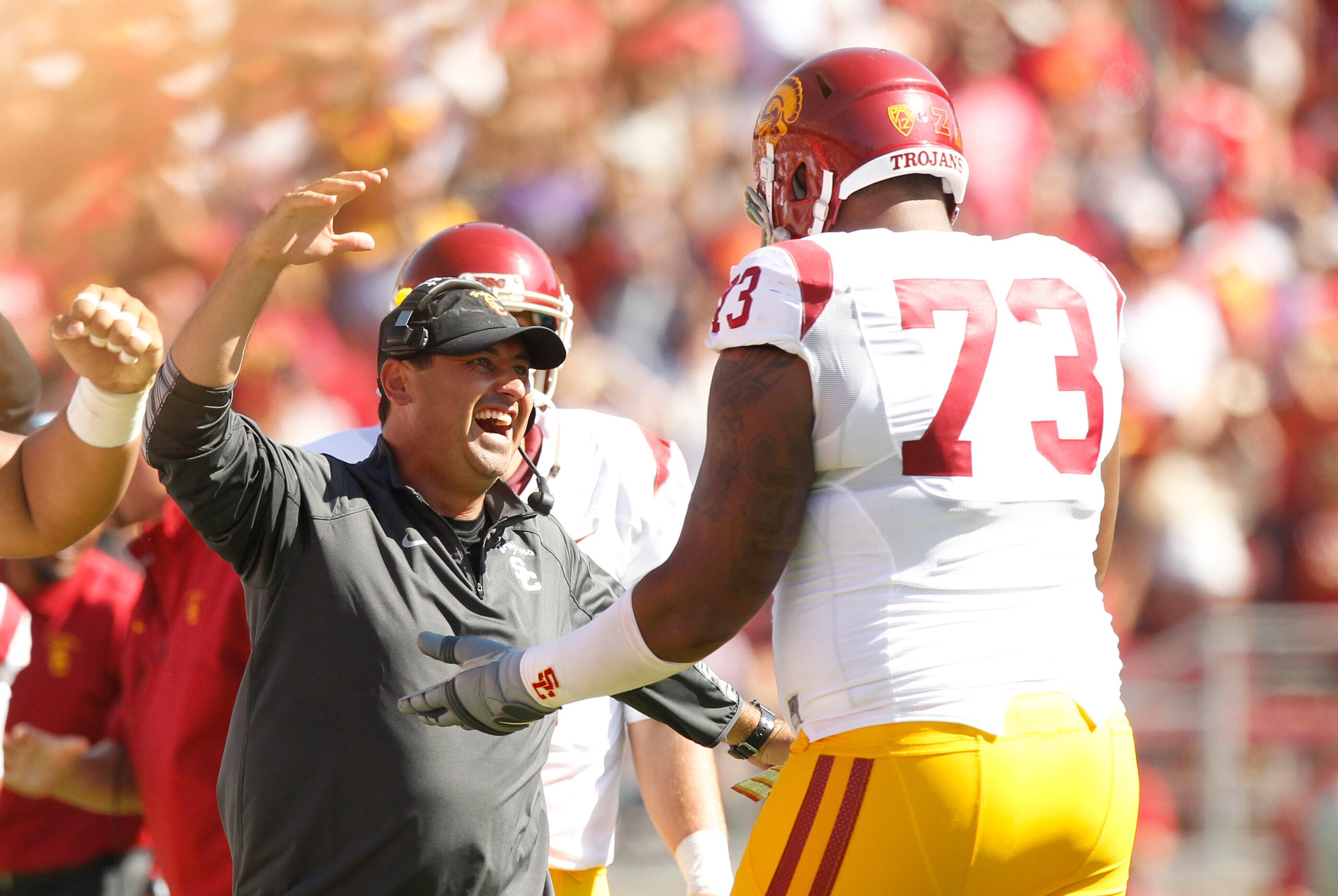 Sep 6, 2014; Stanford, CA, USA; USC Trojans head coach Steve Sarkisian celebrates with offensive tackle Zach Banner (73) after the Trojans recovered a fumble against the Stanford Cardinal in the fourth quarter at Stanford Stadium. The Trojans defeated the