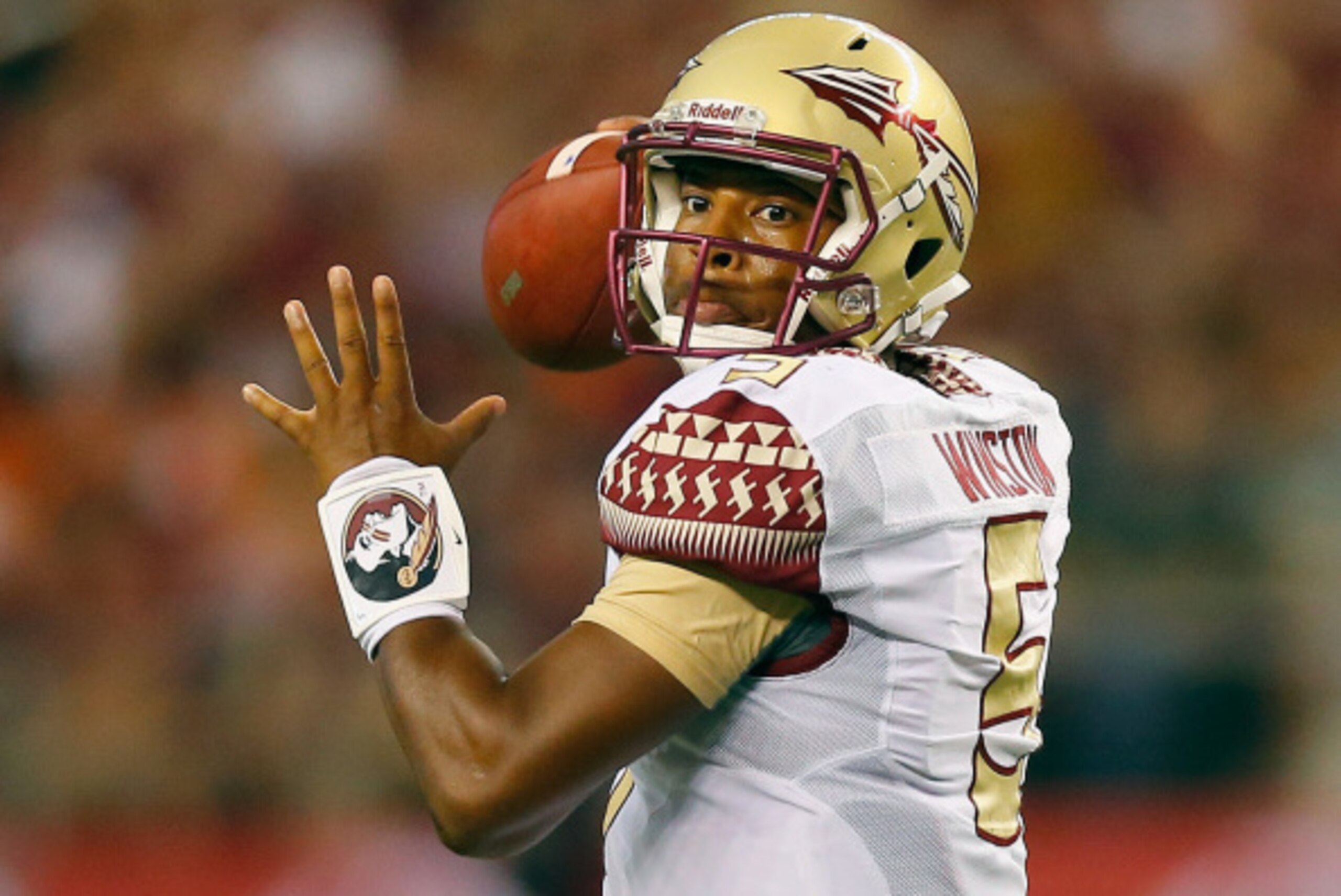 ARLINGTON, TX - AUGUST 30:  Jameis Winston #5 of the Florida State Seminoles passes against the Oklahoma State Cowboys in the first half of the Advocare Cowboys Classic at AT&T Stadium on August 30, 2014 in Arlington, Texas.  (Photo by Tom Pennington/Gett