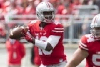 Sep 13, 2014; Columbus, OH, USA; Ohio State Buckeyes quarterback J.T. Barrett (16) looks for an open receiver against the Kent State Golden Flashes at Ohio Stadium. Ohio State won the game 66-0. Mandatory Credit: Greg Bartram-USA TODAY Sports