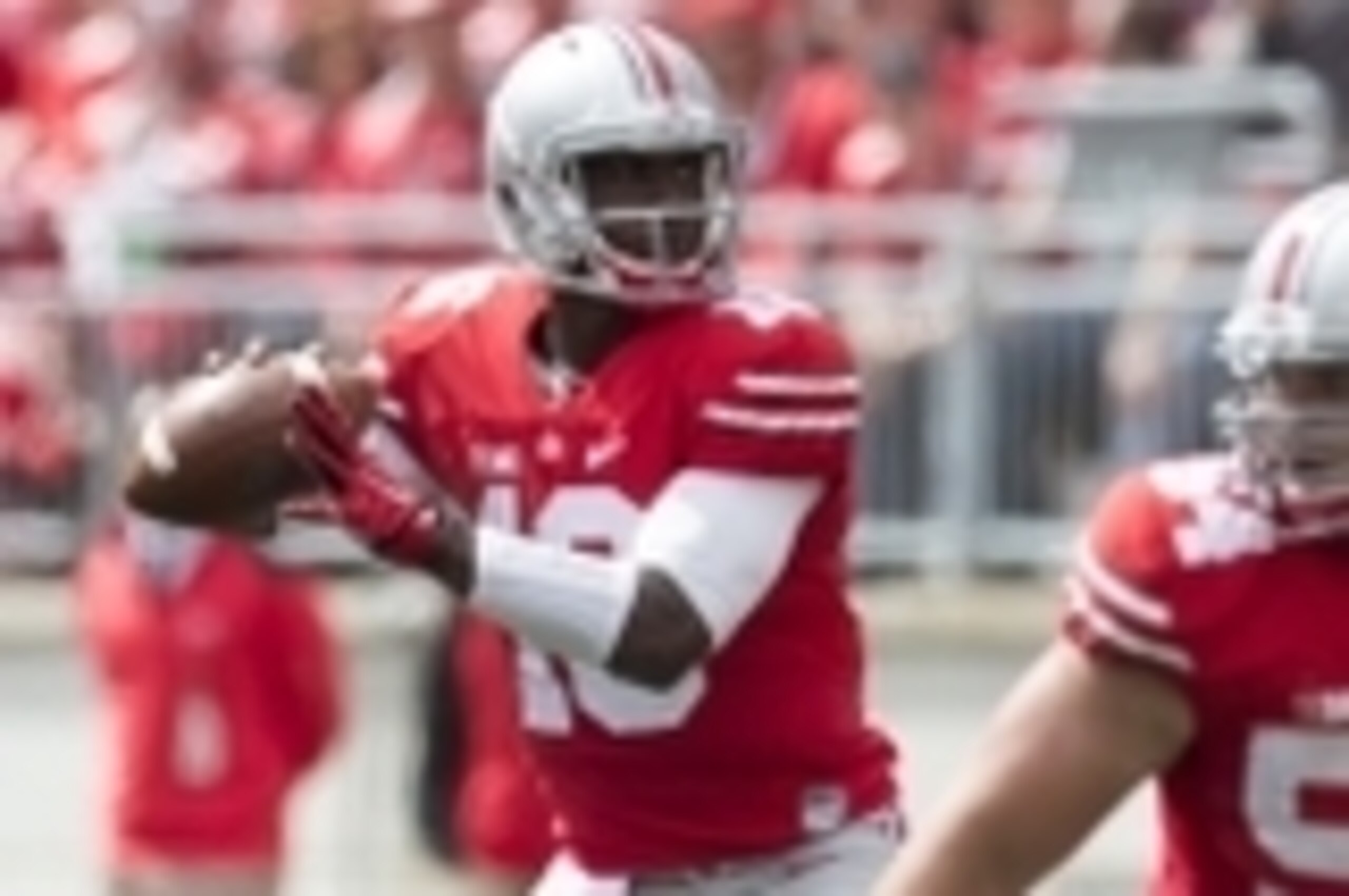 Sep 13, 2014; Columbus, OH, USA; Ohio State Buckeyes quarterback J.T. Barrett (16) looks for an open receiver against the Kent State Golden Flashes at Ohio Stadium. Ohio State won the game 66-0. Mandatory Credit: Greg Bartram-USA TODAY Sports