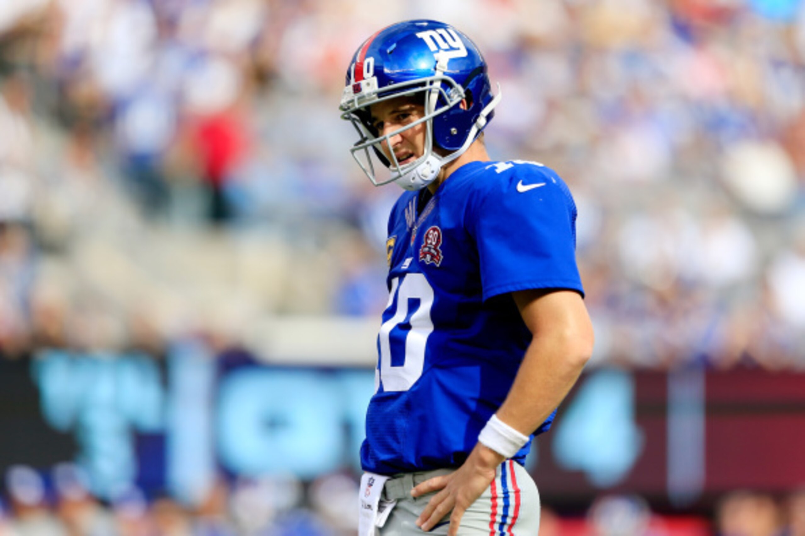 EAST RUTHERFORD, NJ - SEPTEMBER 14:  Quarterback Eli Manning #10 of the New York Giants reacts after a fumble in the fourth quarter against the Arizona Cardinals during a game at MetLife Stadium on September 14, 2014 in East Rutherford, New Jersey.  (Phot