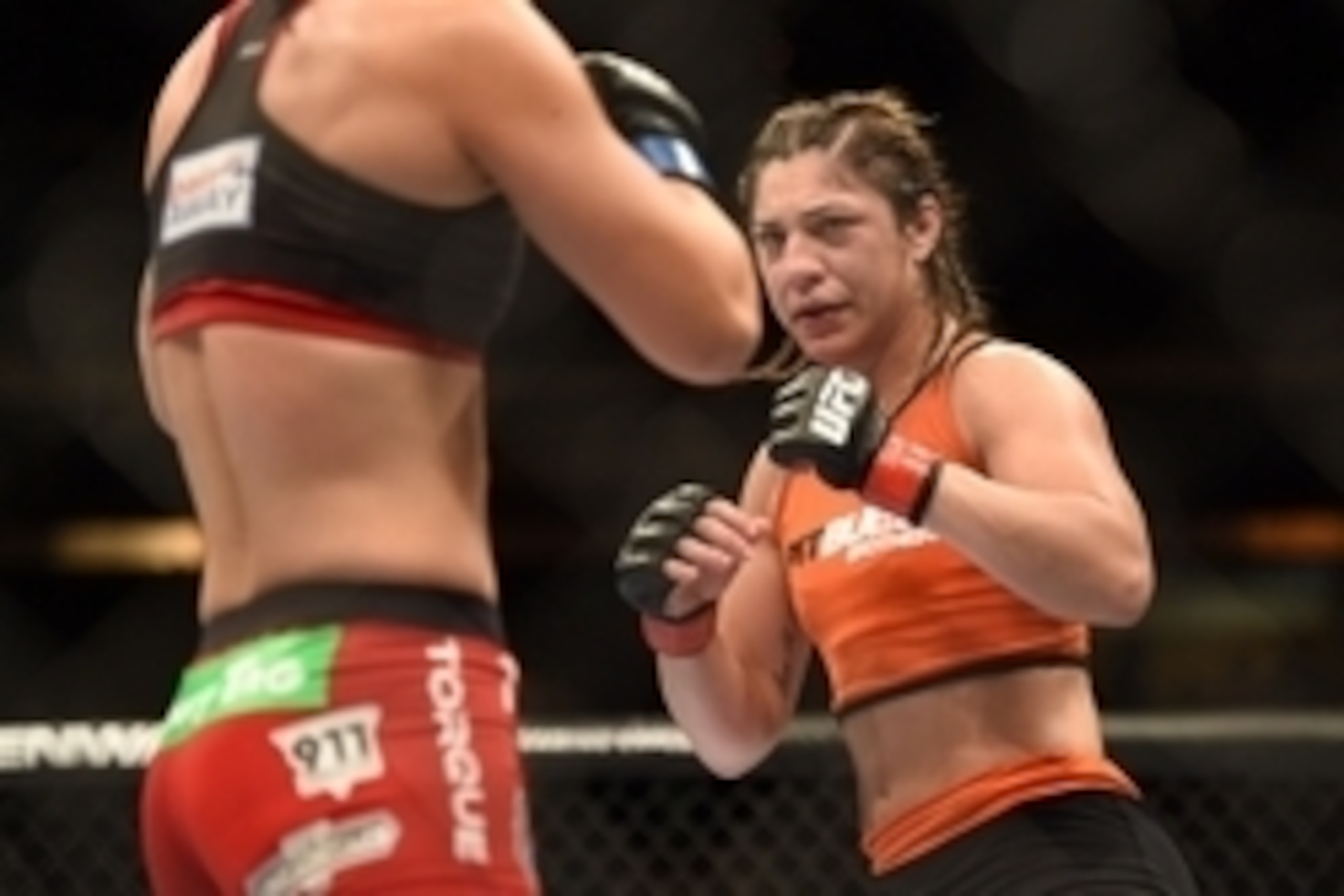 August 30, 2014; Sacramento, CA, USA; Bethe Correia (red gloves) fights against Shayna Baszler (blue gloves) during the women   s bantamweight bout of UFC 177 at Sleep Train Arena. Mandatory Credit: Kyle Terada-USA TODAY Sports