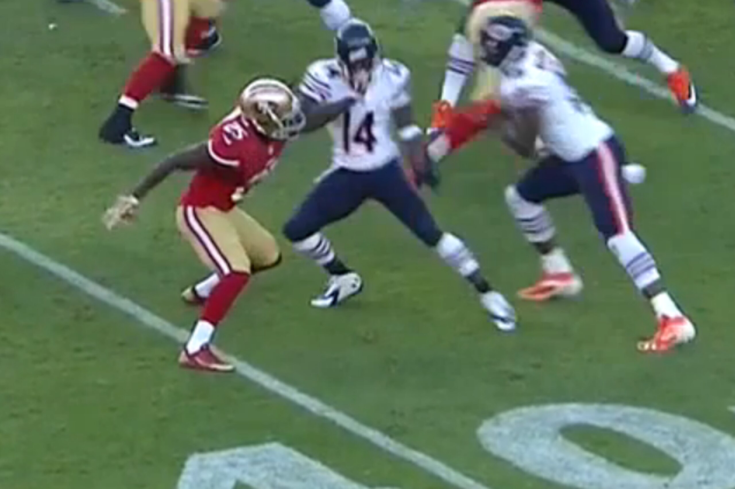 Jimmie Ward grabs Santonio Holmes' facemask.