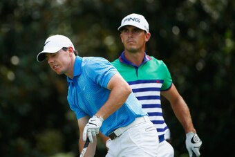 ATLANTA, GA - SEPTEMBER 13:  Rory McIlroy of Northern Ireland (L) watches his tee shot on the eighth hole as Billy Horschel of the United States looks on during the third round of the TOUR Championship by Coca-Cola at the East Lake Golf Club on September 