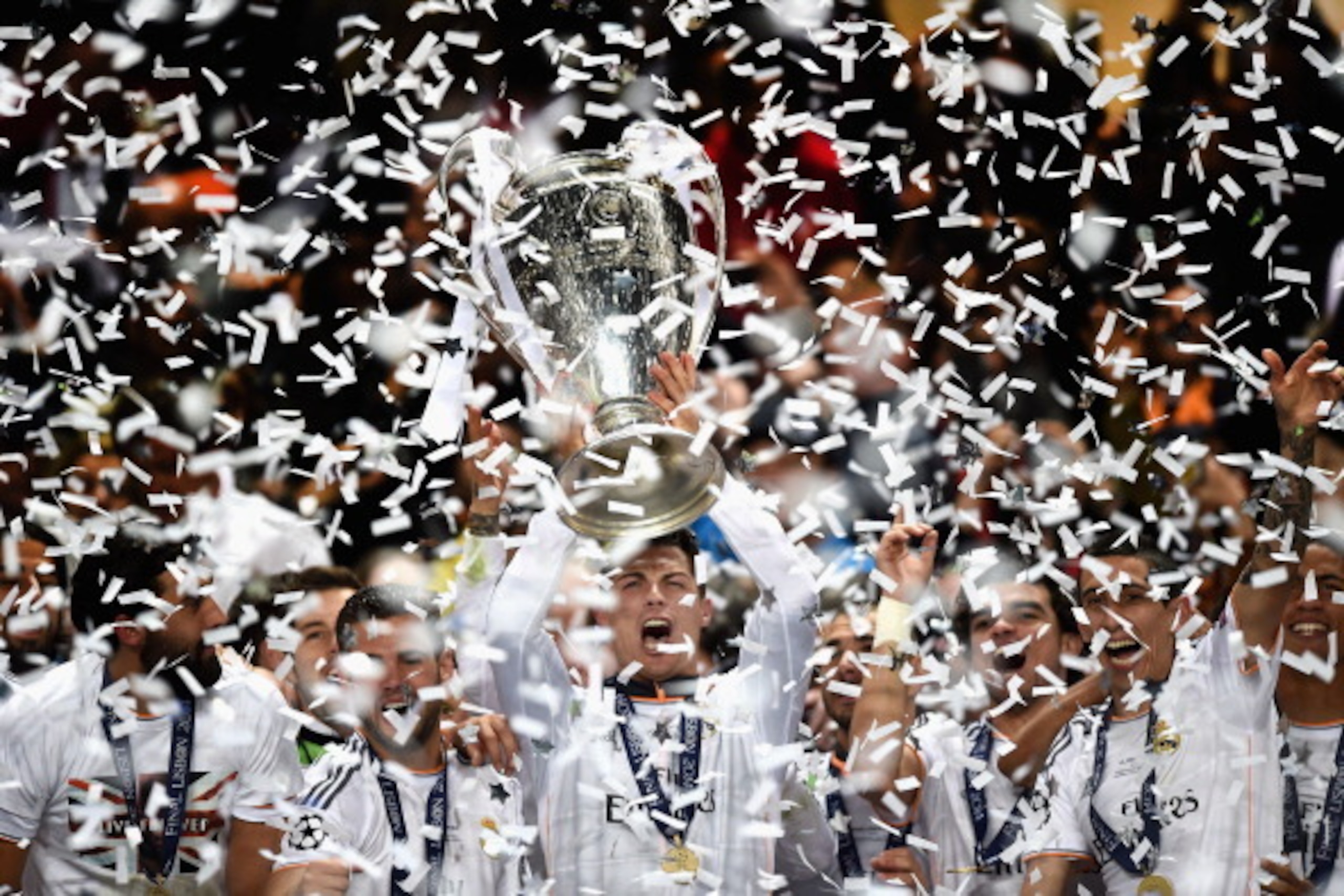 LISBON, PORTUGAL - MAY 24:  Cristiano Ronaldo of Real Madrid lifts the Champions league trophy during the during the UEFA Champions League Final between Real Madrid and Atletico de Madrid at Estadio da Luz on May 24, 2014 in Lisbon, Portugal.  (Photo by L