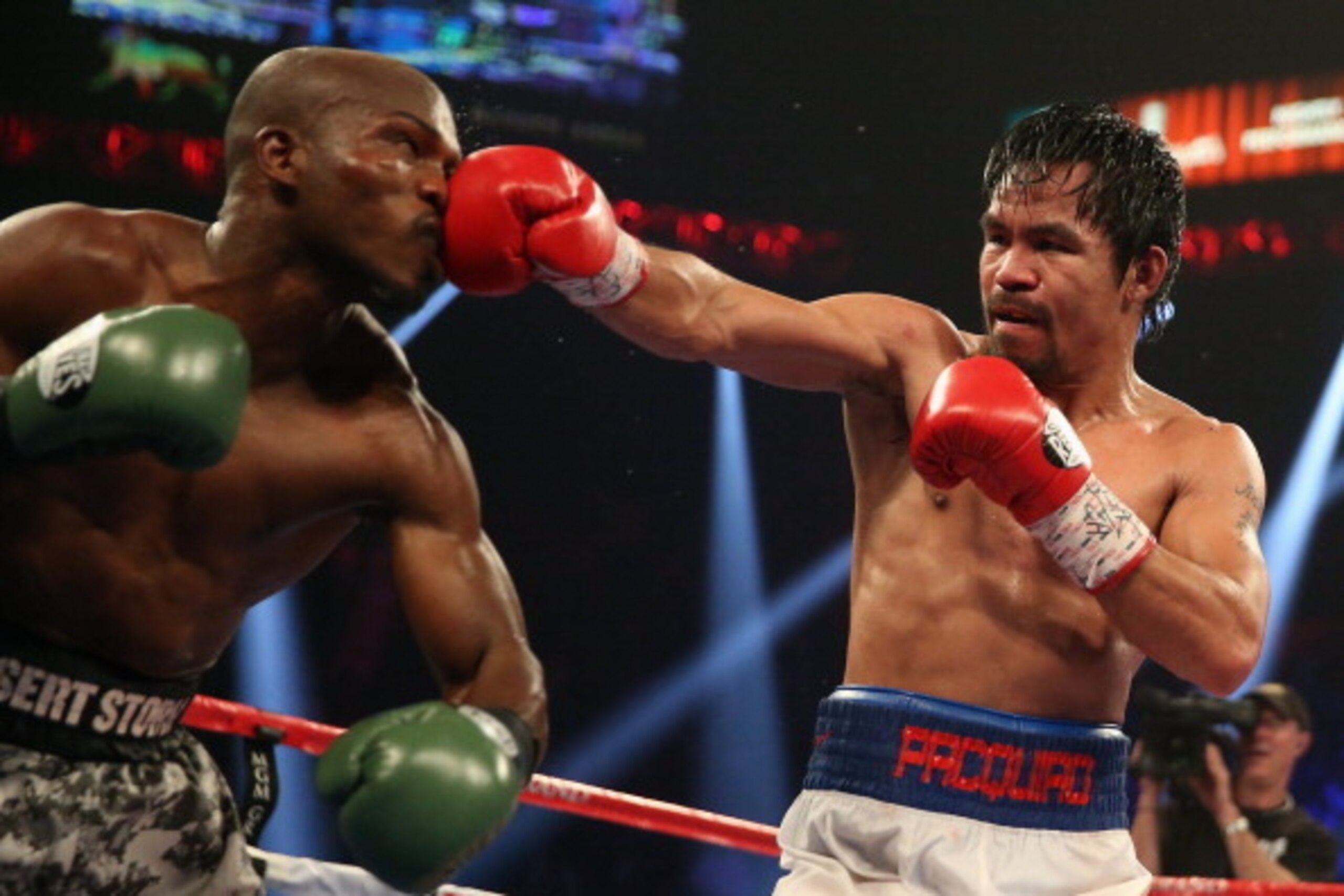 LAS VEGAS, NV - APRIL 12:  Manny Pacquiao throws a right hand at Timothy Bradley at the MGM Grand Garden Arena on April 12, 2014 in Las Vegas, Nevada.  (Photo by Jeff Gross/Getty Images)