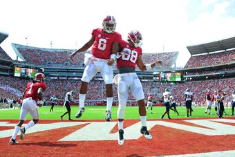 TUSCALOOSA, AL - SEPTEMBER 6: Blake Sims #6 of the Alabama Crimson Tide is congratulated by O. J. Howard #88 after scoring a first quarter touchdown against the Florida Atlantc Owls at Bryant-Denny Stadium on September 6, 2014 in Tuscaloosa, Alabama. (Pho