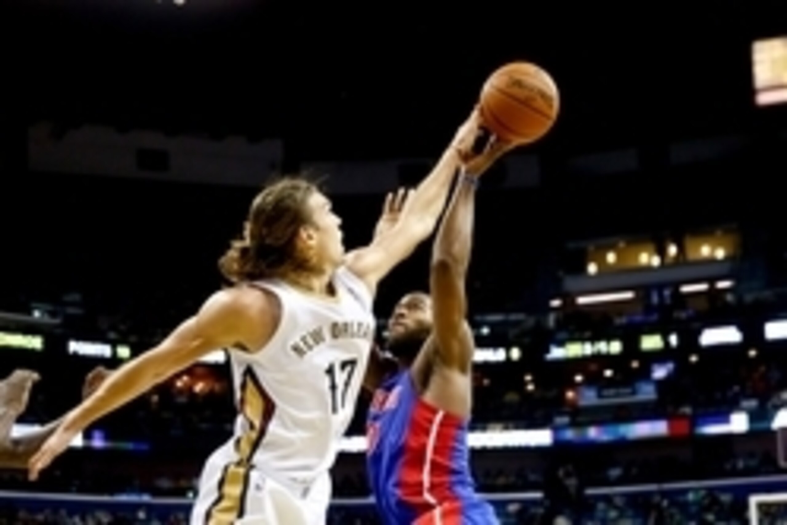 Dec 11, 2013; New Orleans, LA, USA; New Orleans Pelicans power forward Lou Amundson (17) blocks a shot by Detroit Pistons power forward Greg Monroe (10) during the second half at New Orleans Arena. The Pelicans defeated the Pistons 111-106 in overtime. Ma
