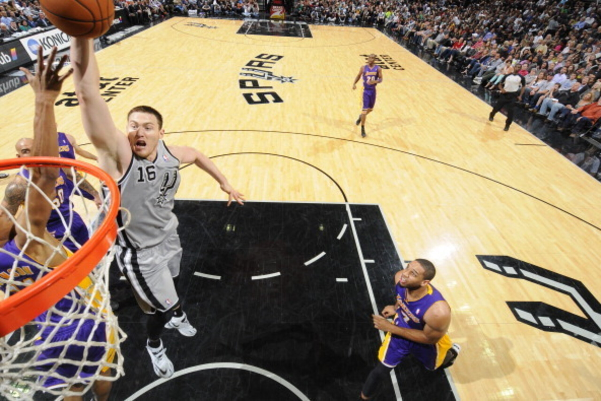 SAN ANTONIO, TX - March 14: Aron Baynes #16 of the San Antonio Spurs dunks against the Los Angeles Lakers at the AT&T Center on March 14, 2014 in San Antonio, Texas. NOTE TO USER: User expressly acknowledges and agrees that, by downloading and or using th