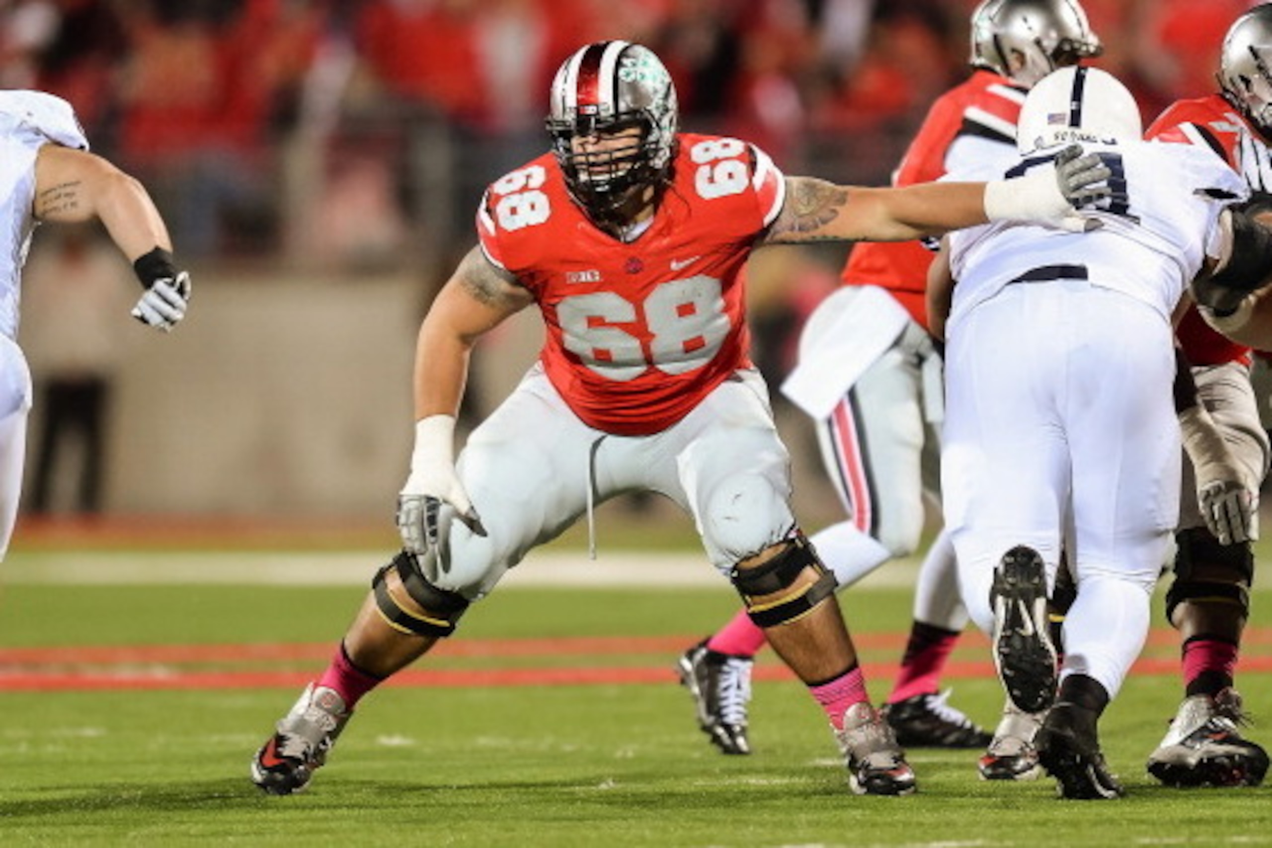 COLUMBUS, OH - OCTOBER 26:  Taylor Decker #68 of the Ohio State Buckeyes blocks against the Penn State Nittany Lions at Ohio Stadium on October 26, 2013 in Columbus, Ohio.  (Photo by Jamie Sabau/Getty Images)