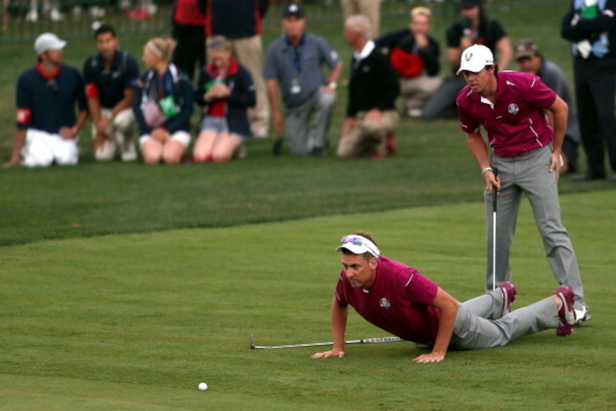 MEDINAH, IL - SEPTEMBER 29: Ian Poulter and Rory McIlroy of Europe line up a putt on the 18th hole during day two of the Afternoon Four-Ball Matches for The 39th Ryder Cup at Medinah Country Club on September 29, 2012 in Medinah, Illinois. (Photo by And MEDINAH, IL - SEPTEMBER 29: Ian Poulter and Rory McIlroy of Europe line up a putt on the 18th hole during day two of the Afternoon Four-Ball Matches for The 39th Ryder Cup at Medinah Country Club on September 29, 2012 in Medinah, Illinois. (Photo by And