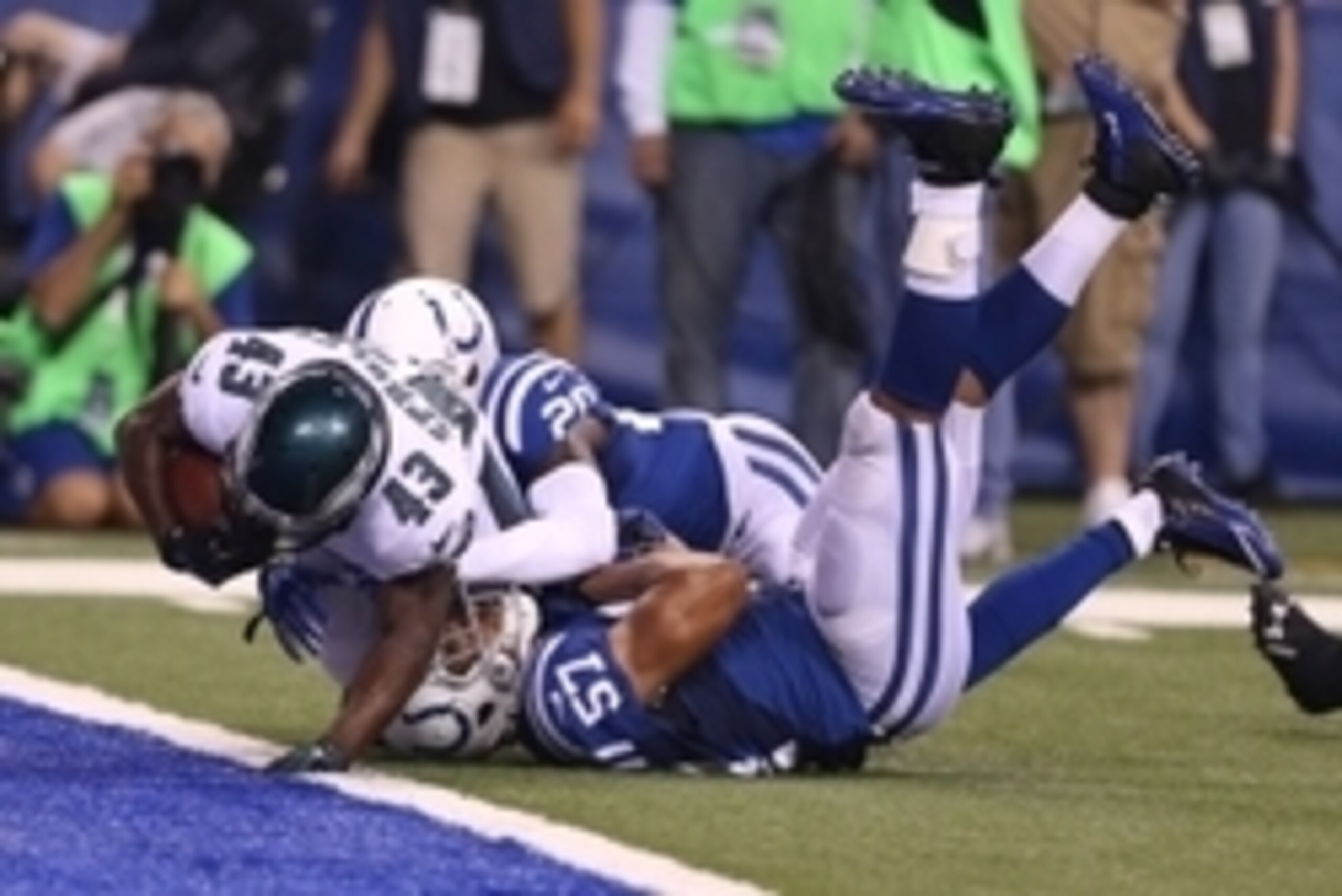 Sep 15, 2014; Indianapolis, IN, USA; Philadelphia Eagles running back Darren Sproles (43) scores a touchdown as he breaks a tackle by Indianapolis Colts linebacker Josh McNary (57) at Lucas Oil Stadium. Mandatory Credit: Brian Spurlock-USA TODAY Sports