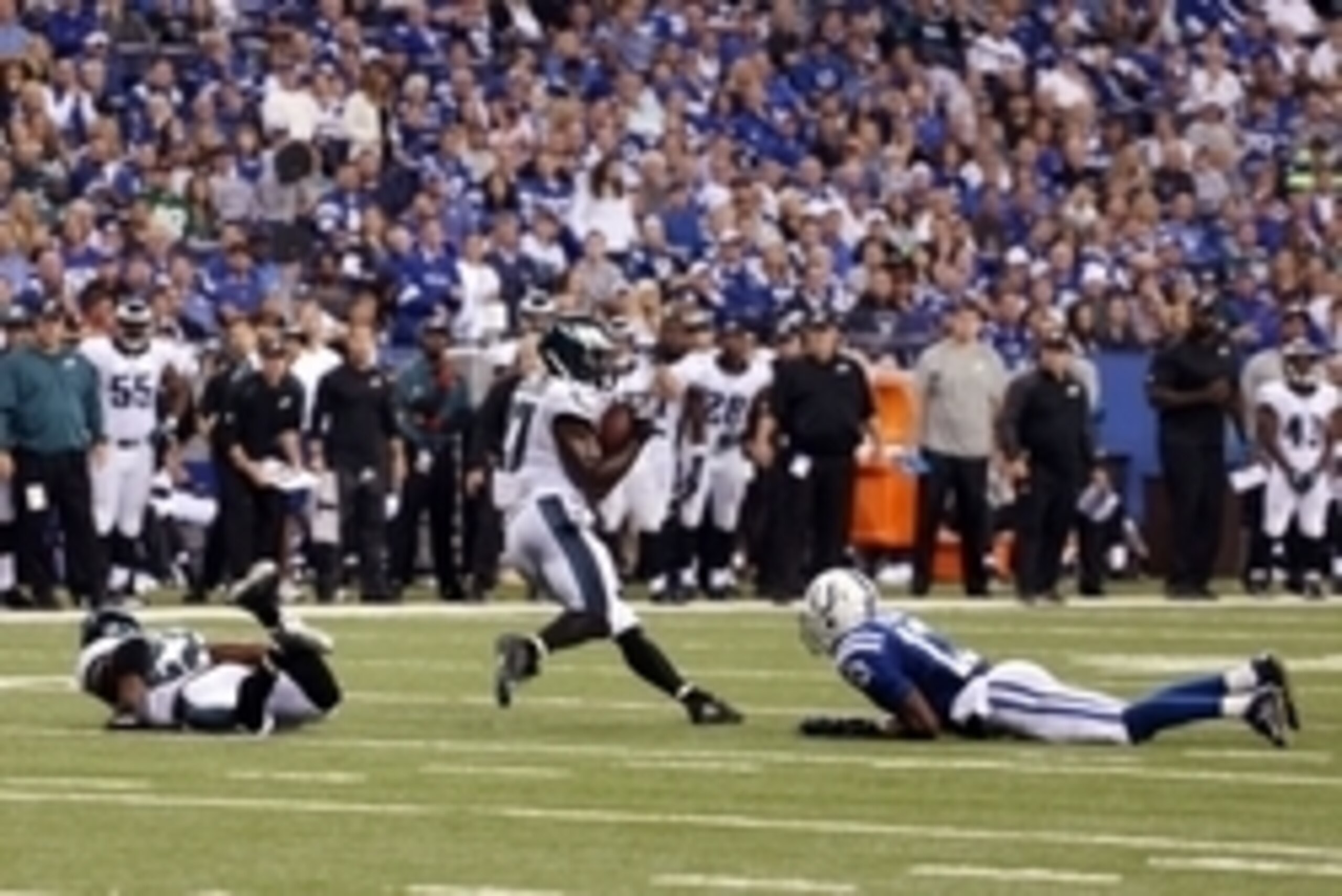 Sep 15, 2014; Indianapolis, IN, USA; Indianapolis Colts wide receiver T.Y. Hilton (13) lays on the ground as Philadelphia Eagles safety Malcolm Jenkins (27) intercepts the ball at Lucas Oil Stadium.  The result was a controversial play in the game. Philad