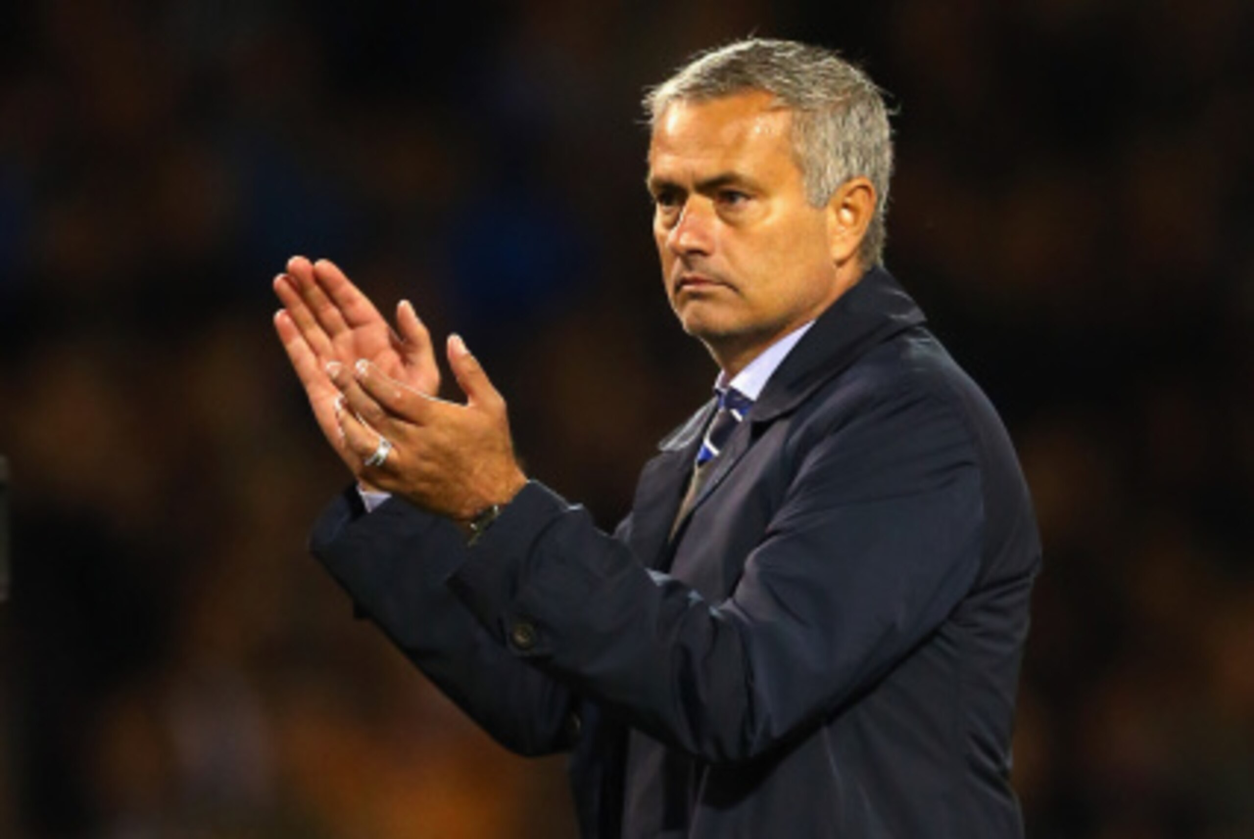 BURNLEY, ENGLAND - AUGUST 18:  Chelsea manager Jose Mourinho walks off the pitch at the final whistle during the Barclays Premier League match between Burnley and Chelsea at Turf Moor on August 18, 2014 in Burnley, England.  (Photo by Clive Brunskill/Gett