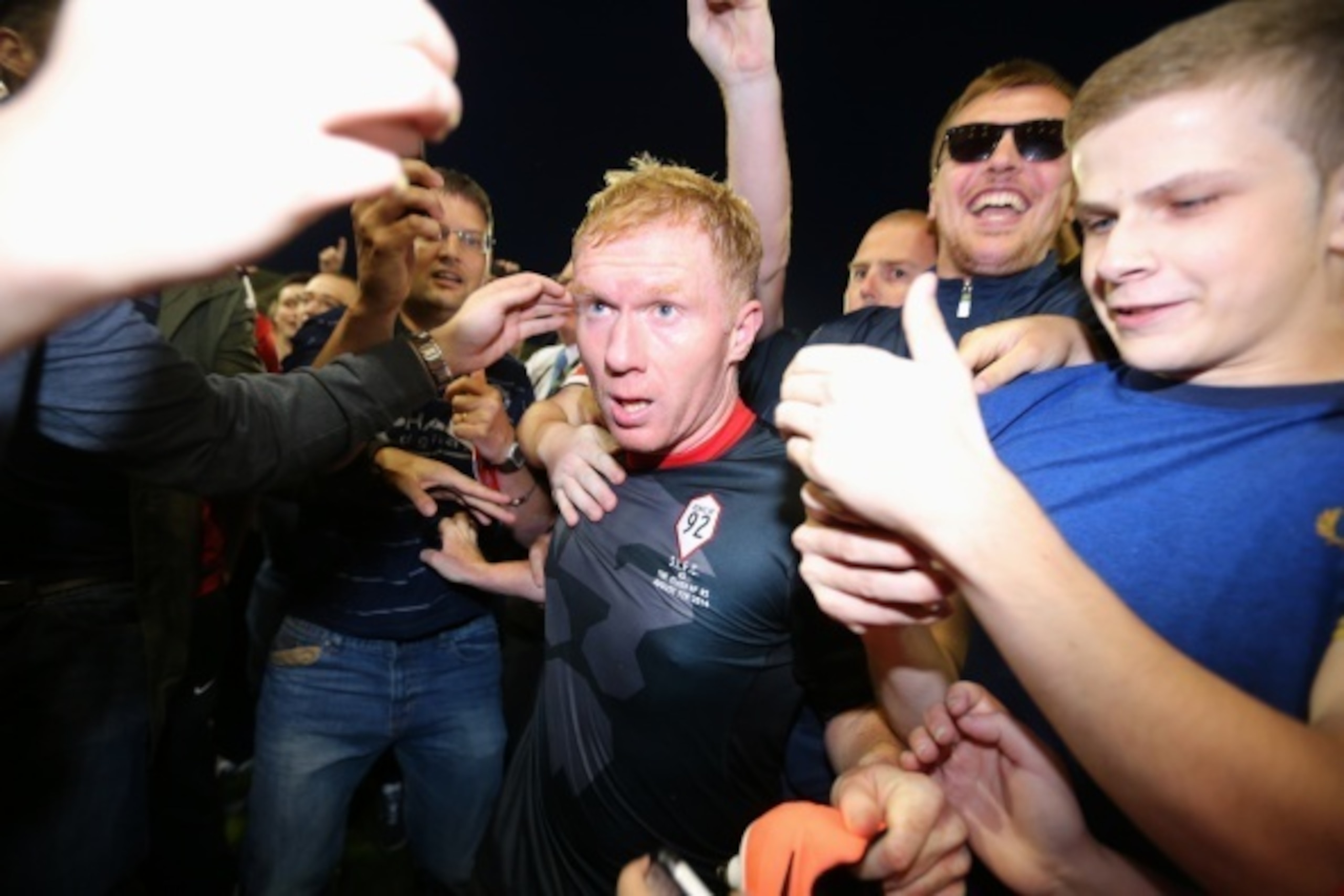 SALFORD, ENGLAND - AUGUST 07: Paul Scholes of the Class of '92 XI is mobbed by fans at the end of the match between Salford City and the Class of '92 XI at AJ Bell Stadium on August 7, 2014 in Salford, England. (Photo by Dave Thompson/Getty Images) SALFORD, ENGLAND - AUGUST 07: Paul Scholes of the Class of '92 XI is mobbed by fans at the end of the match between Salford City and the Class of '92 XI at AJ Bell Stadium on August 7, 2014 in Salford, England. (Photo by Dave Thompson/Getty Images)