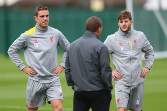 LIVERPOOL, ENGLAND - SEPTEMBER 15:  Liverpool manager Brendan Rodgers has a word with L-R Jordan Henderson and Adam Lallana during a training session ahead of their UEFA Champions League group B match against PFC Ludogorets on September 15, 2014 in Liverp