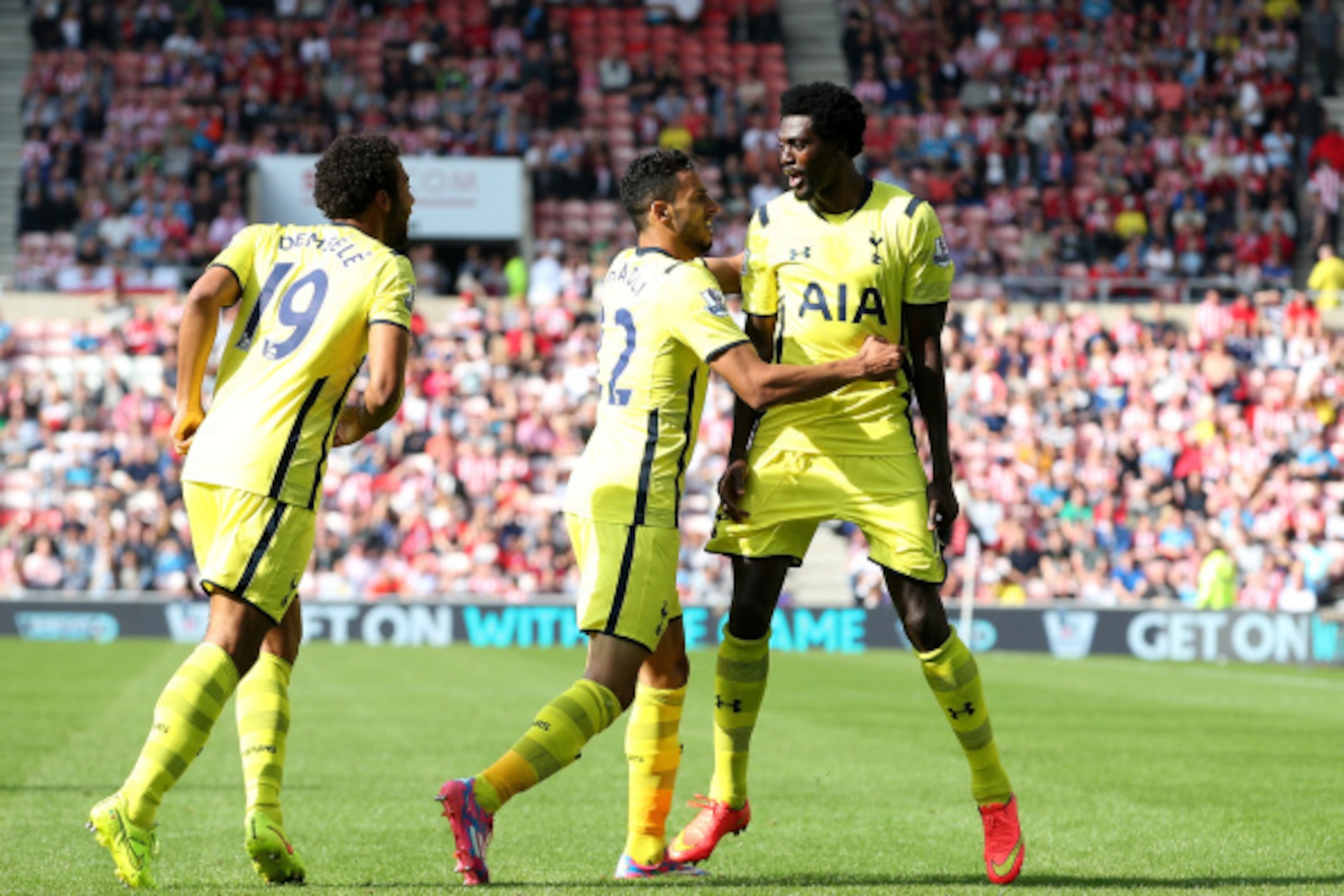 SUNDERLAND, ENGLAND - SEPTEMBER 13: Nacer Chadli of Spurs (C) celebrates scoring the opening goal with Mousa Dembele and Emmanuel Adebayour of Spurs during the Barclays Premier League match between Sunderland and Tottenham Hotspur at Stadium of Light on S