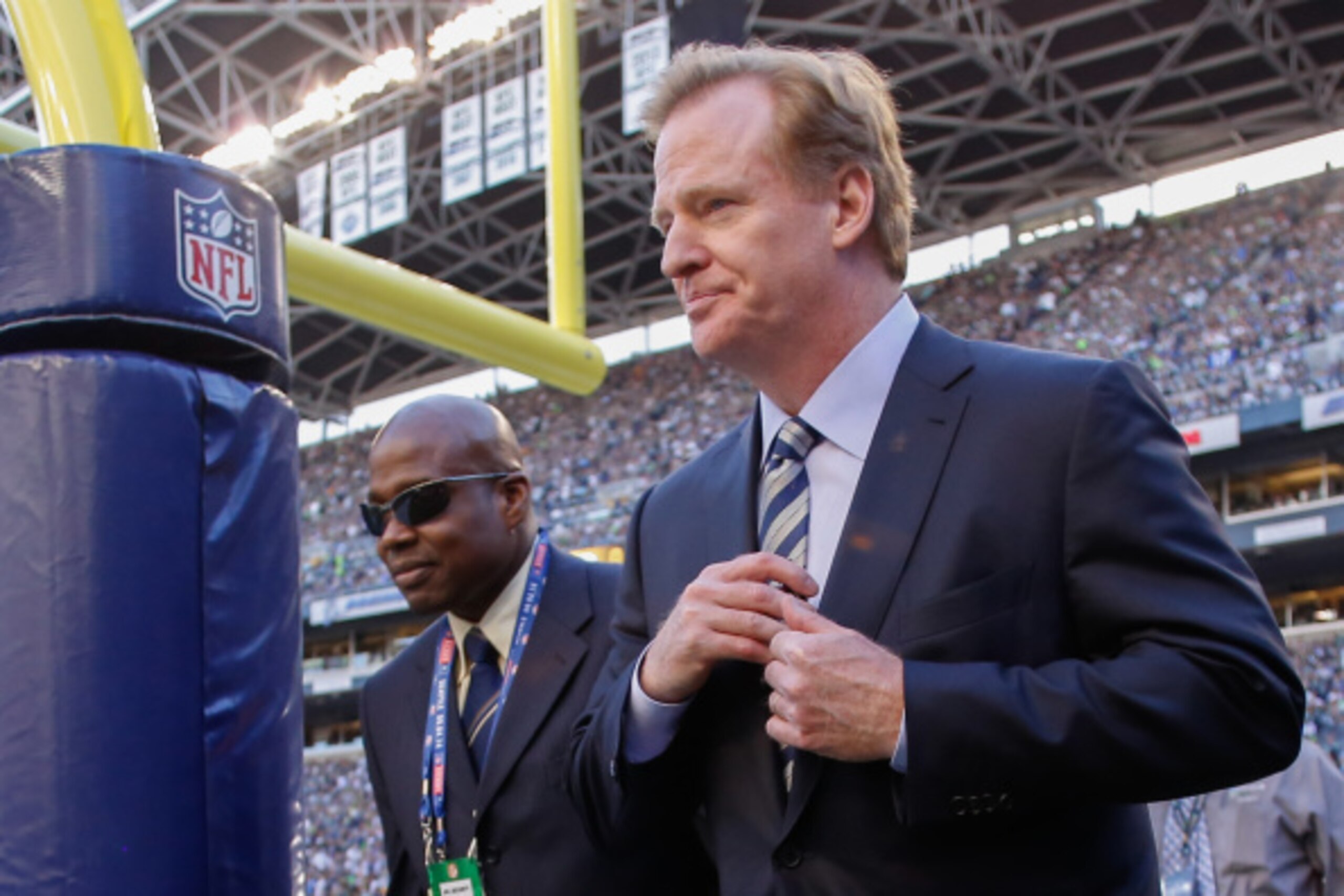 SEATTLE, WA - SEPTEMBER 04:  NFL commissioner Roger Goodell (R) walks the sidelines prior to the game between the Seattle Seahawks and the Green Bay Packers at CenturyLink Field on September 4, 2014 in Seattle, Washington.  (Photo by Otto Greule Jr/Getty 