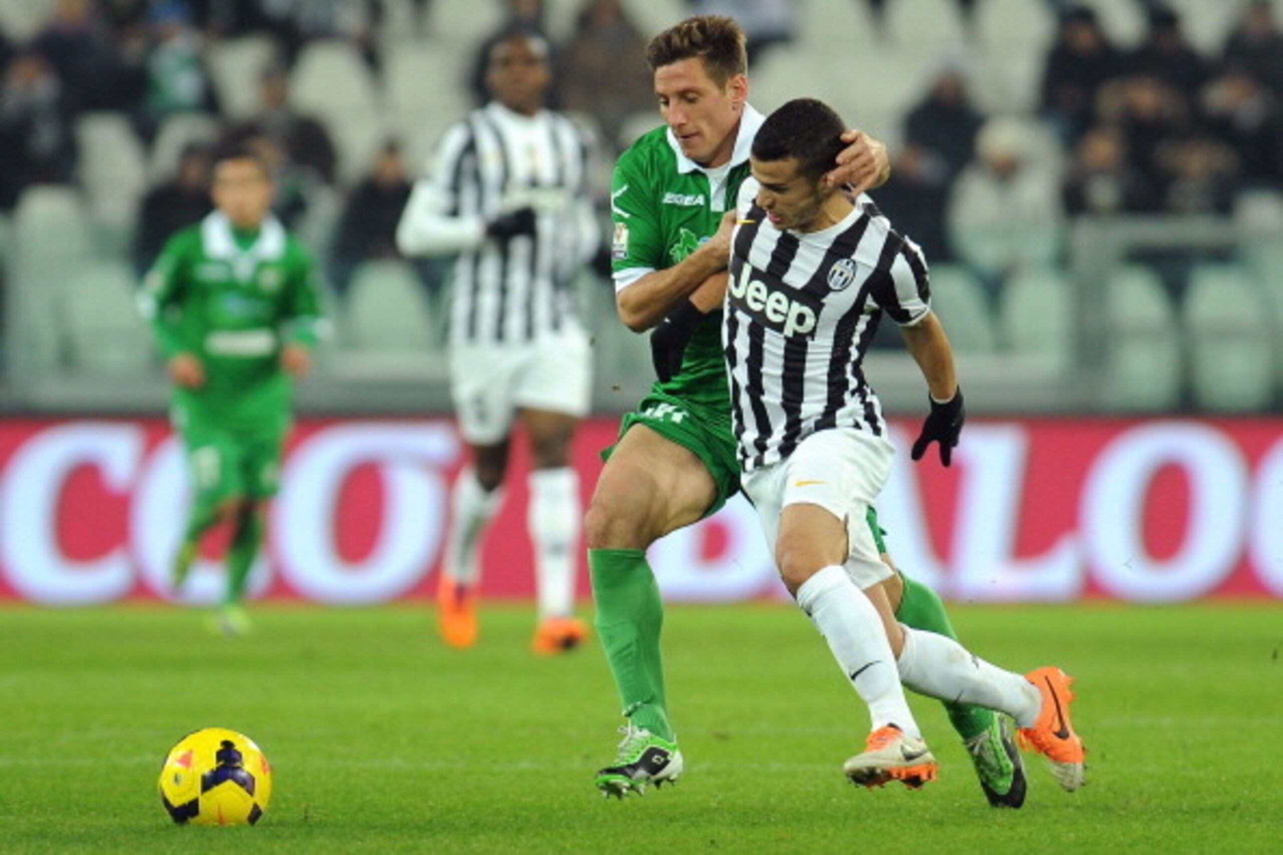 TURIN, ITALY - DECEMBER 18:  Sebastian Giovinco (R) of Juventus is challenged by Eros Schiavon of US Avellino during the Tim Cup match between Juventus and US Avellino at Juventus Arena on December 18, 2013 in Turin, Italy.  (Photo by Valerio Pennicino/Ge