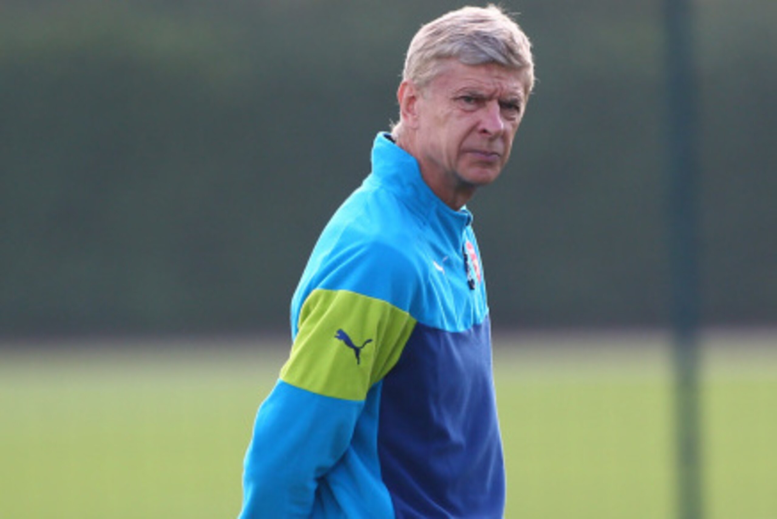 ST ALBANS, ENGLAND - SEPTEMBER 15: Arsenal manager Arsene Wenger keeps an eye on the session during a Arsenal Training Session ahead of their Champions League fixture against Borussia Dortmund on September 15, 2014 in St Albans, England. (Photo by Charlie