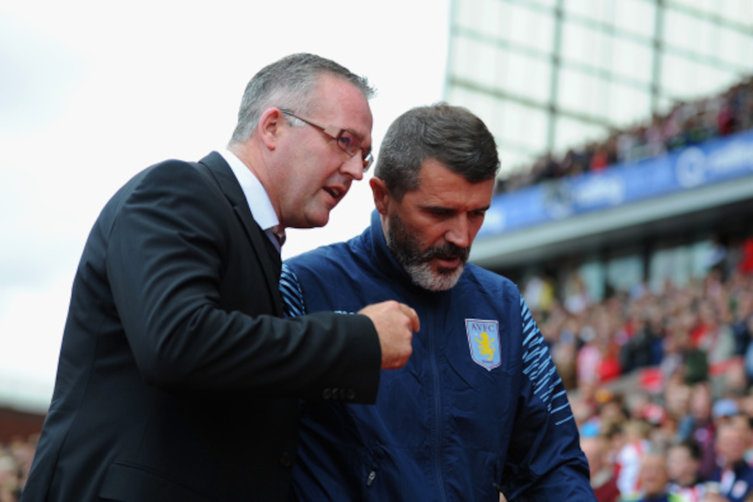 STOKE ON TRENT, ENGLAND - AUGUST 16: Manager Paul Lambert of Aston Villa talks to assistant Roy Keane during the Barclays Premier League match between Stoke City and Aston Villa at Britannia Stadium on August 16, 2014 in Stoke on Trent, England.  (Photo b